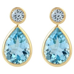 Birnenförmiger Vivid Blue Topas & Saphir Ohrring in 18K Gelbgold