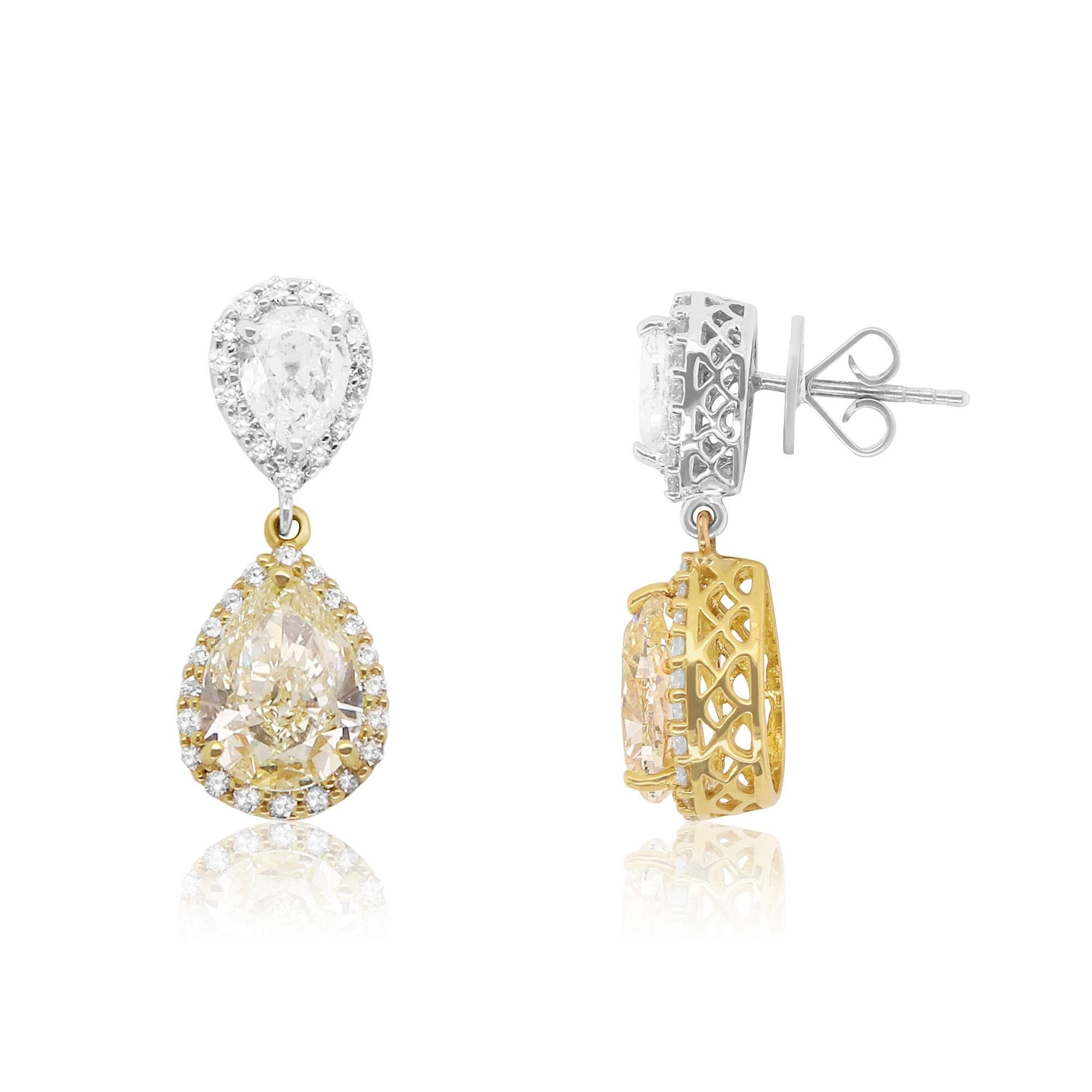 Material: 18K Two-Tone Gold
Center Stones:  2 Pear Shaped Yellow Diamonds at 4.52 Carats. Clarity/ VS-1
Both Yellow Diamonds are GIA Certified. Please see the photos for certificates.

White Diamond Details: 2 Pear Shaped White Diamonds at 1.24
