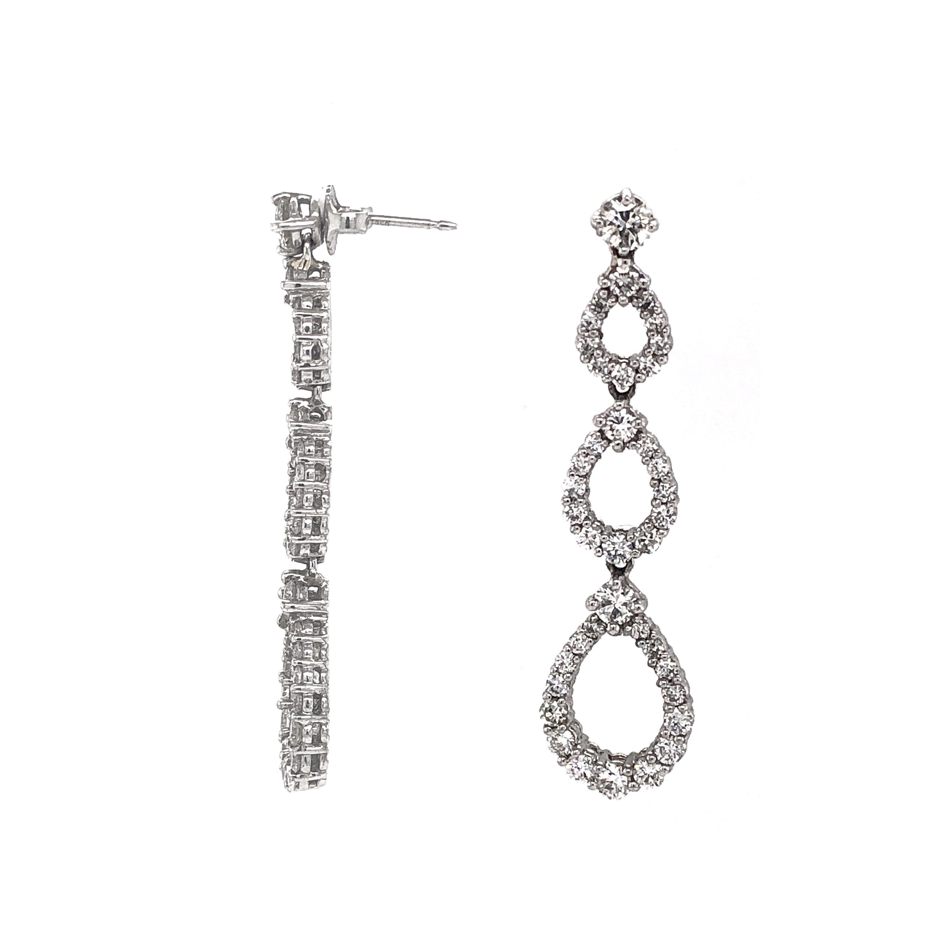 Beautiful classic design of pear shapes dangling platinum earrings adorned in white round diamonds 4.53 ct.   
Diamonds are white and natural in G-H Color Clarity VS.
Platinum 950 metal.
Butterfly studs.
Simple and modern design makes this a