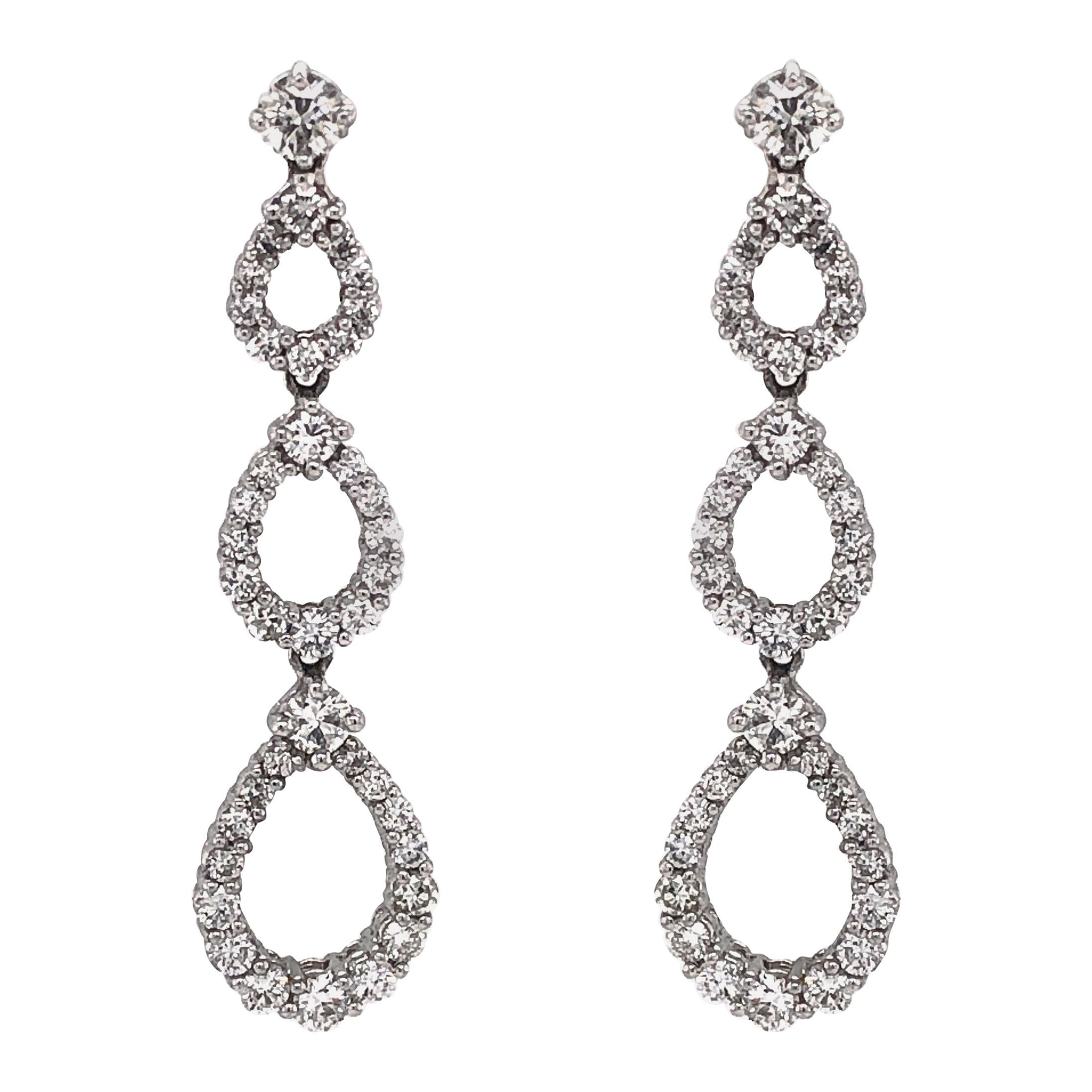 Pear Shapes Round Cut White Diamonds 4.53 Carat Dangling Platinum Earrings For Sale