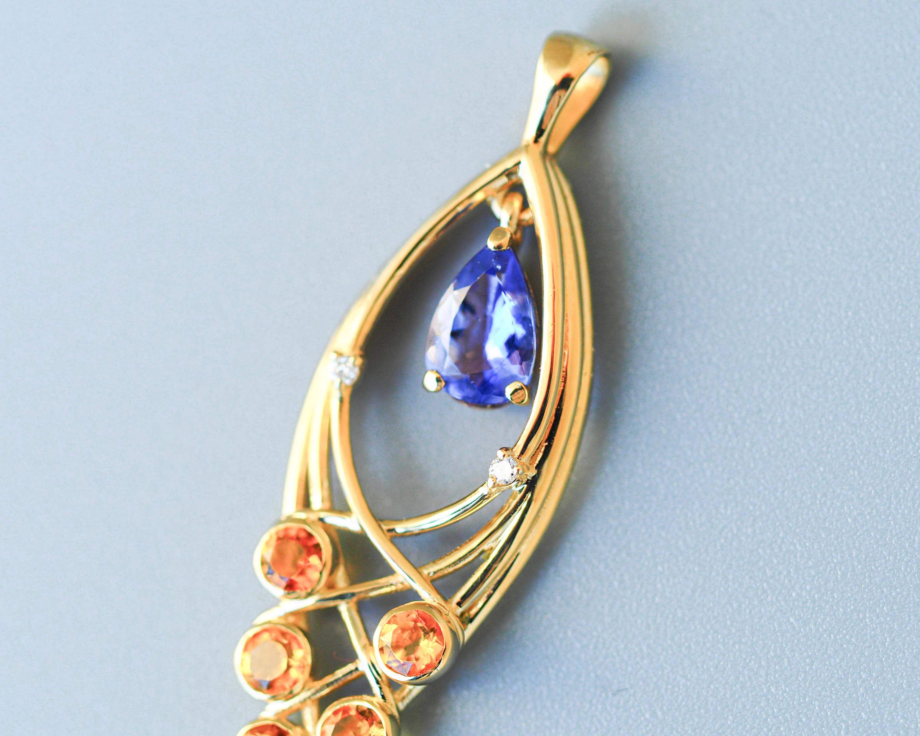 Modern Pear tanzanite 14k gold pendant.  For Sale