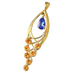 Pear tanzanite 14k gold pendant. 