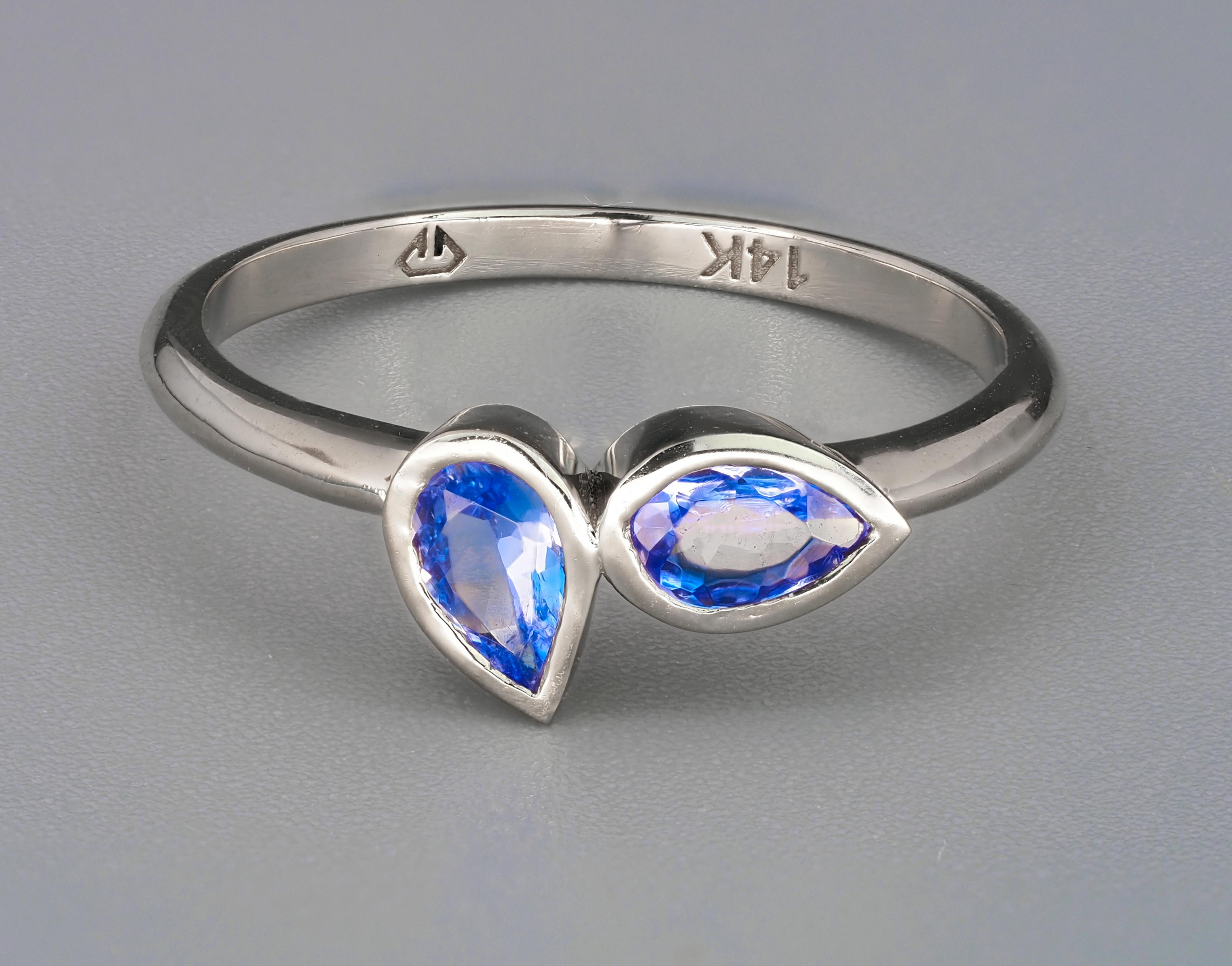 Pear Tanzanite 14k gold ring. 
2 tanzanite ring. Tanzanite minimalist ring. Tanzanite delicate ring. Bezel set tanzanite ring.

Weight: 1.85 g. depends from size
Metal: 14k gold

Central stones: 2 pieces tanzanites
Cut: pears
Weight: aprx 0.95 ct.