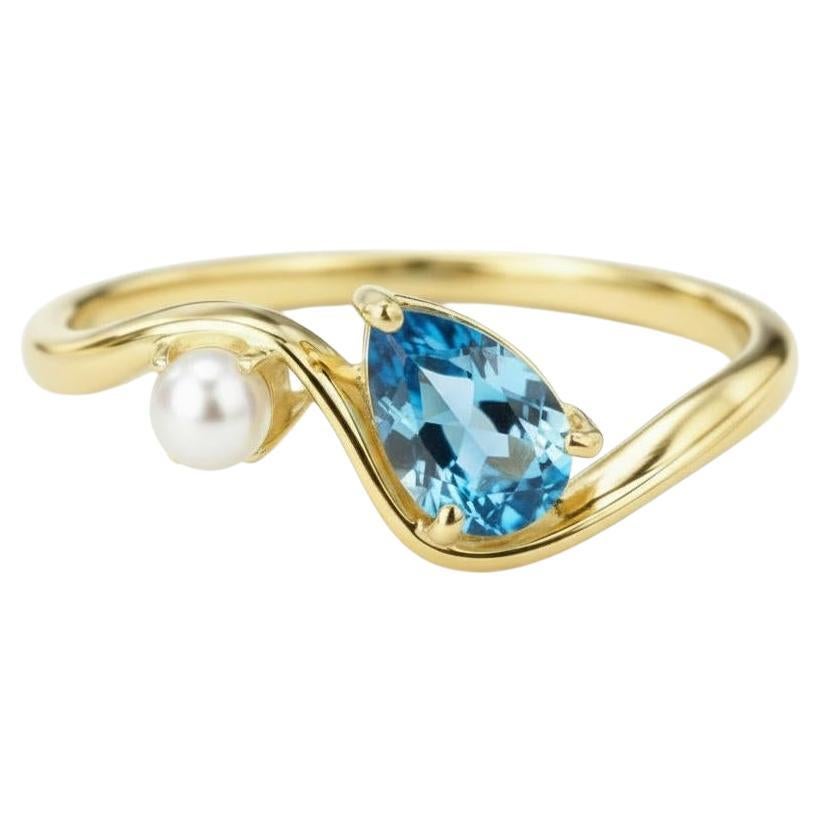 Anillo de oro de 14k con topacio perlado y perlas