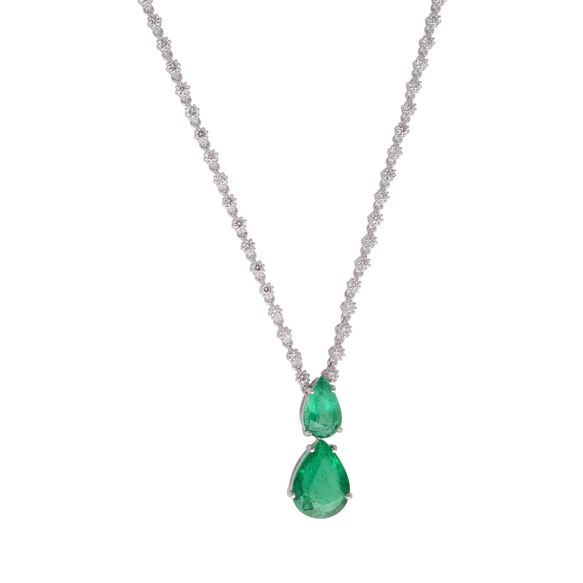The emerald and diamonds are set in a solid 18k white gold charm pendant, providing a luxurious and enduring setting that perfectly enhances their beauty. The white gold setting not only complements the gemstones and diamonds but also adds a touch