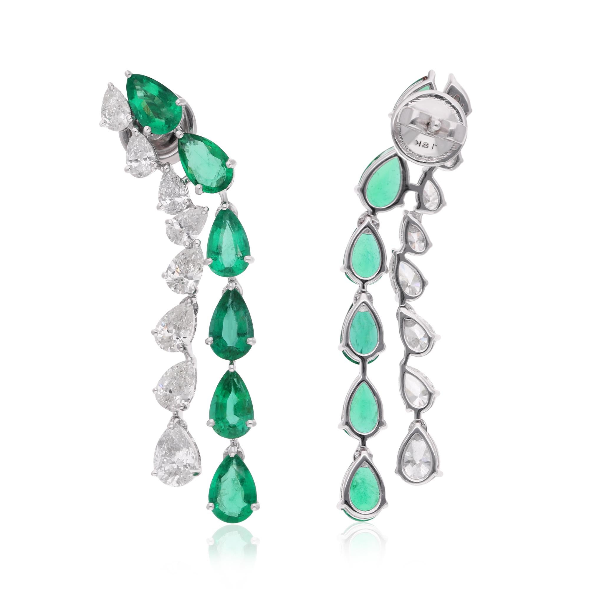 Immerse yourself in the enchanting beauty of these Pear Zambian Emerald Gemstone Earrings, adorned with sparkling diamonds and meticulously crafted in 14 karat white gold. Each detail of these earrings is a testament to the allure of Zambian