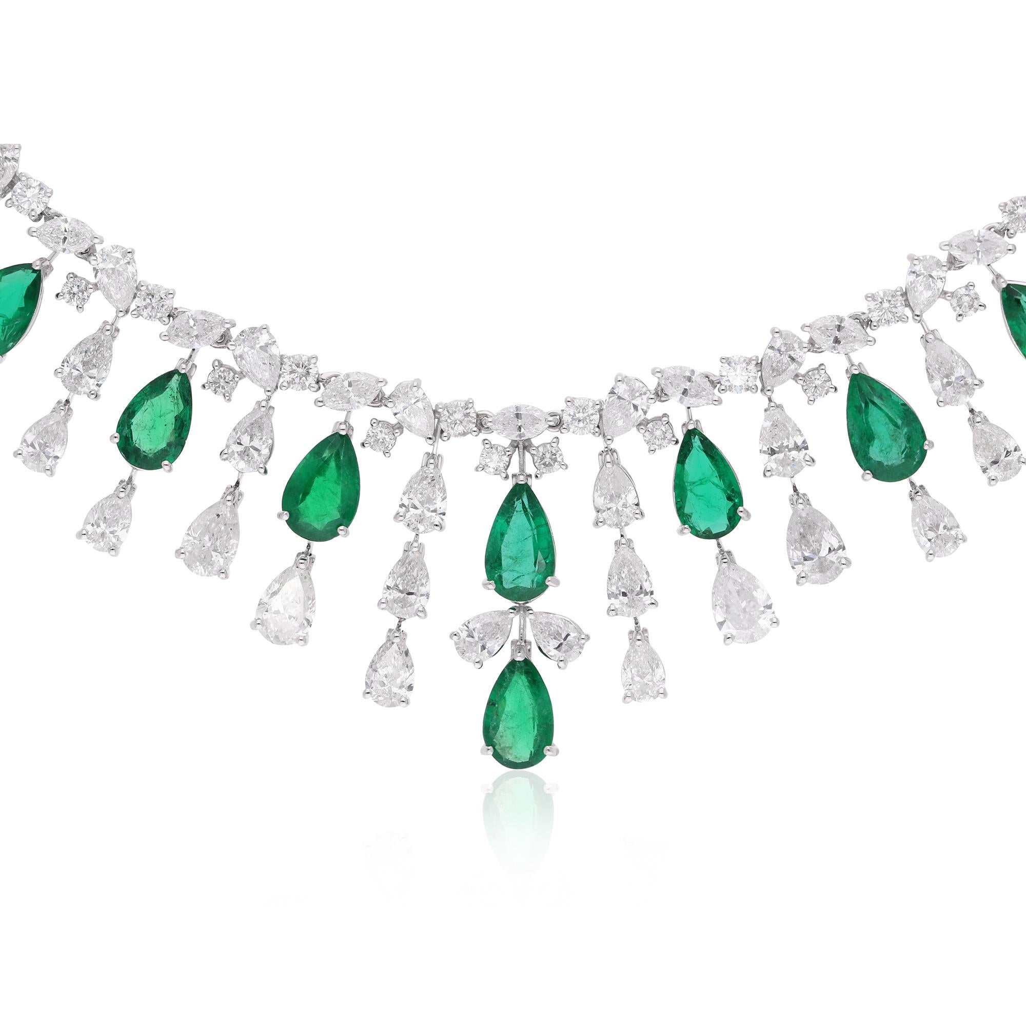 Crafted with meticulous attention to detail, the necklace is fashioned in 14 Karat White Gold, adding a timeless elegance to the design. The lustrous white gold setting provides the perfect backdrop for the emerald and diamonds, creating a