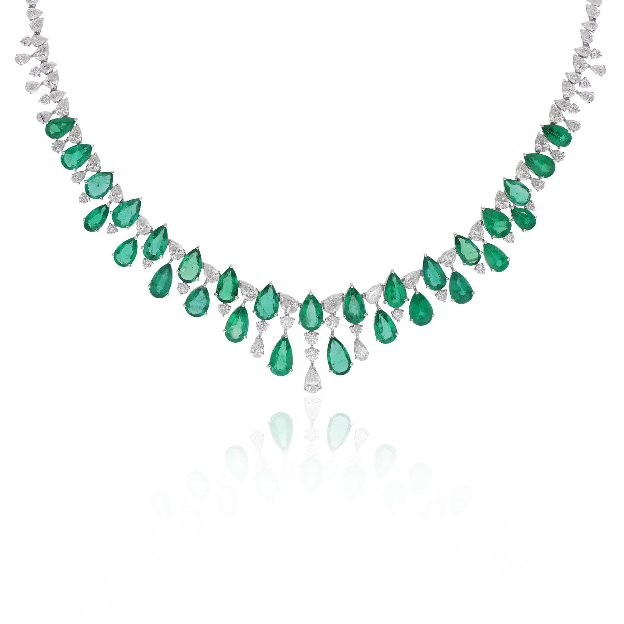 Elevate your jewelry collection with the enchanting beauty of this Pear Zambian Emerald Gemstone Necklace, adorned with exquisite pear and round diamonds, set in lustrous 14 karat white gold. This stunning necklace exudes sophistication and luxury,