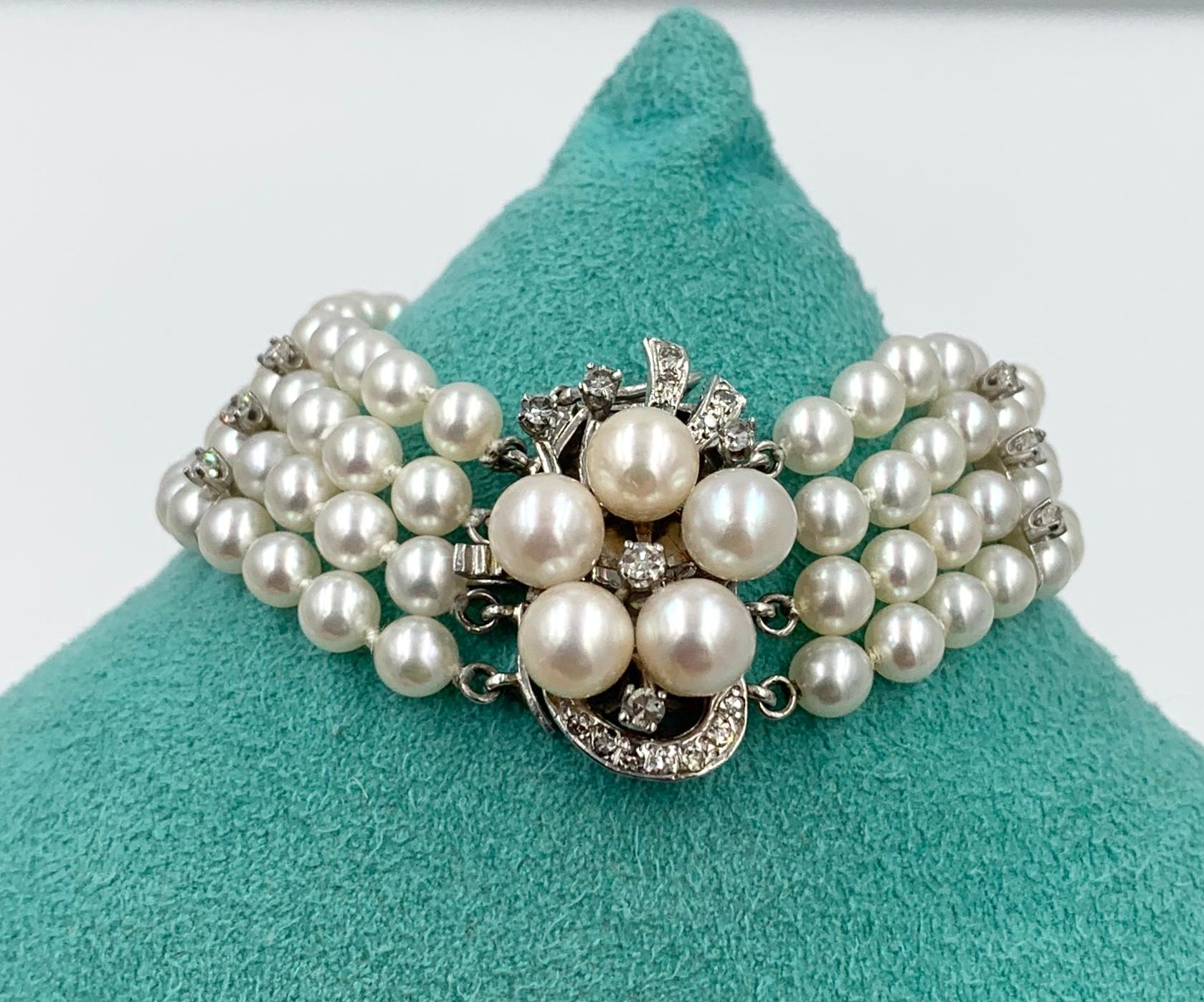 A gorgeous antique Pearl and Diamond Bracelet in 14 Karat White Gold.  The Retro Hollywood Regency jewel is a stunner. 
It has four rows of 4.0-4.5mm White Rose Pearls.  The Pearls are AA rated and very beautiful.  The Pearls have 3 white gold knife
