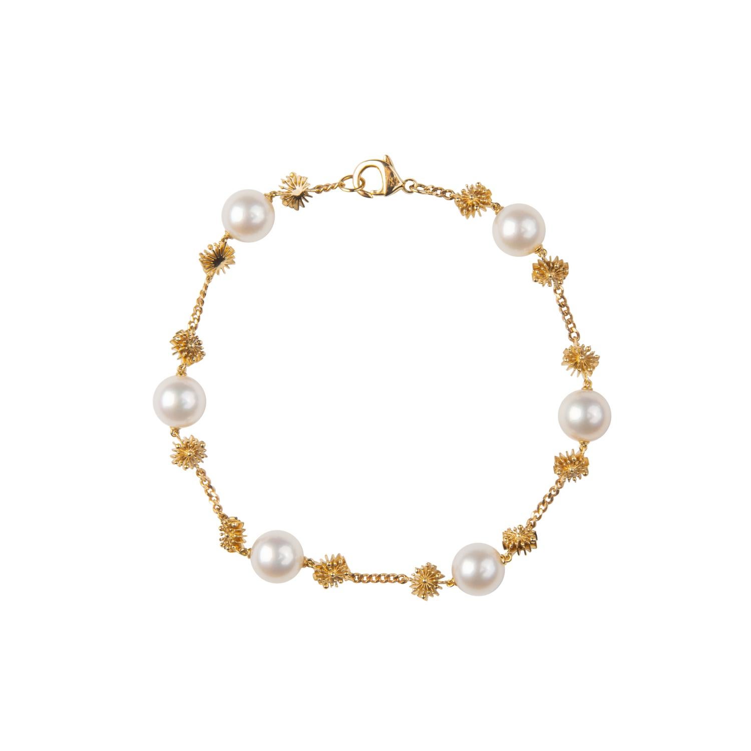 The ‘Soleil’ Pearl Bracelet by Natalie Barney feature 7mm Freshwater Pearls with fine sun shapes. It is the perfect discreet piece for everyday wear and comes with the matching necklace and drop earrings.

Made in 9 karat yellow gold. 

Radiate