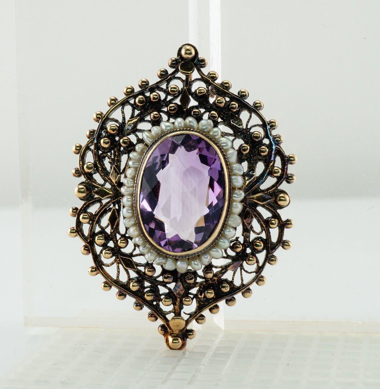 Pearl Amethyst Large Pendant Brooch 14K Gold Vintage

This one of a kind vintage pendant / brooch is finely crafted in solid 14K Yellow gold. The center absolutely stunning bezel set natural Earth mined Amethyst measures 17 x 12mm (about 12.20