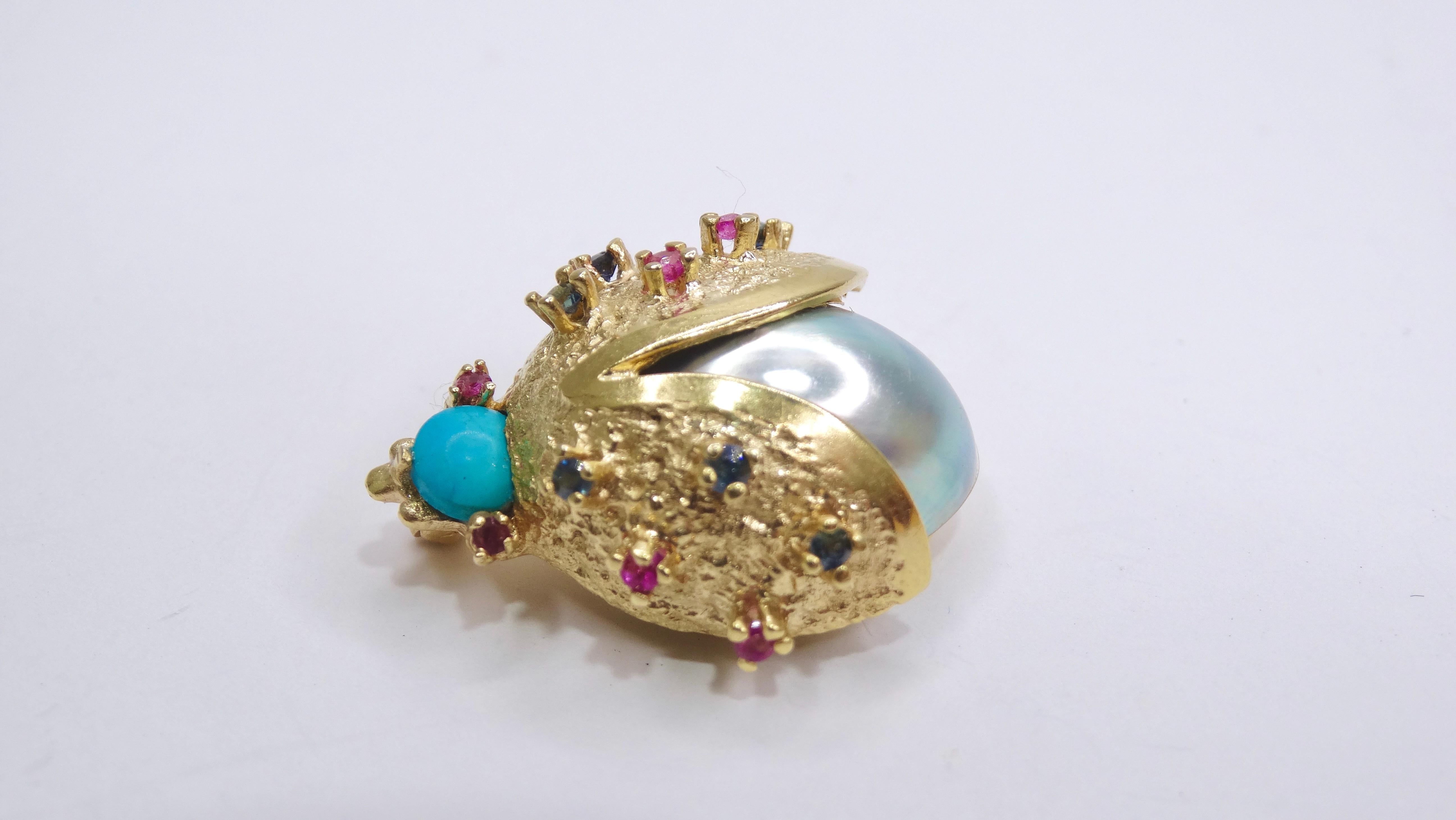 Add a little playfulness to your outfit with this cute ladybug brooch. Made of a large pearl body paired with 14k gold, turquoise, Sapphire, and Ruby. Wait for the compliments as everyone will be admiring the adorable adornment. Wear this broach on