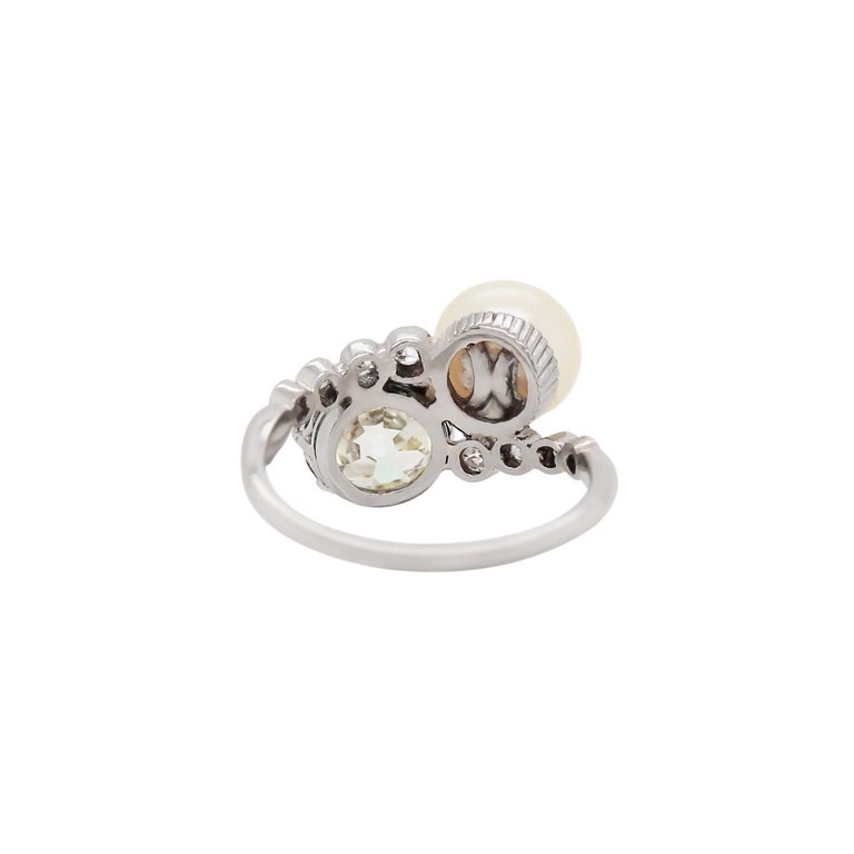 Old European Cut Pearl and 1.69ct Old Cut Diamond Two Stone Crossover Platinum Ring, circa 1920s For Sale