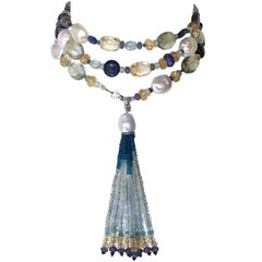 Sautoir en perle et pierre semi-précieuse bleue avec pompon et or 14 carats