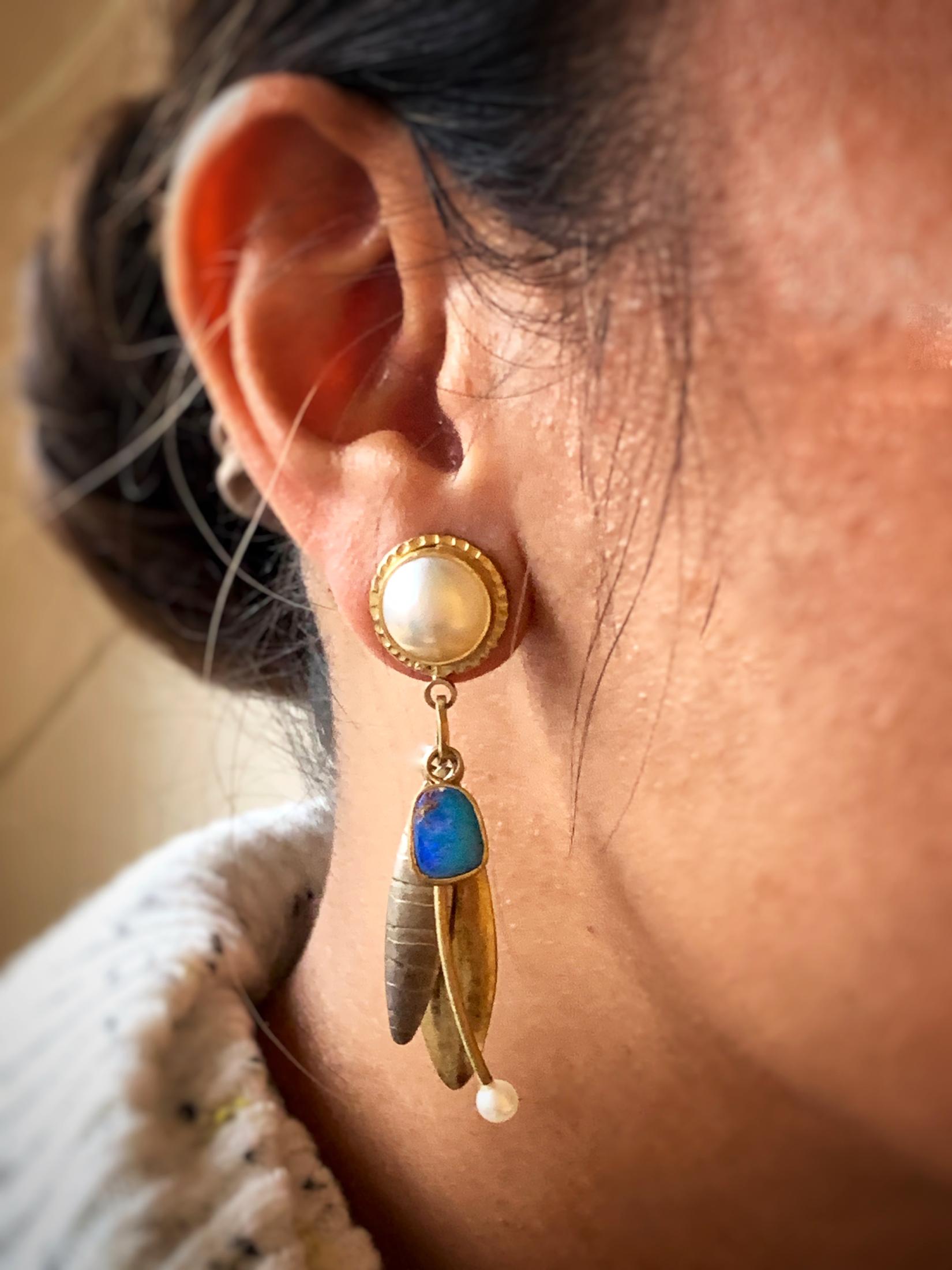 Original, hand made earrings by Designer Sydney Lynch.  Main Pearls are approximately 11mm in diameter are bezel set in hand crafted gold work.  Additional accent pearls at bottom of earrings measure approximately 4mm.  Freeform Boulder Opals