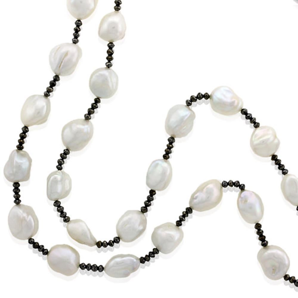 This lovely pave bead and fresh water pearl and brown ice diamond bead necklace is long and charming to layer on any color outfit.

Diamond: 28.7cts