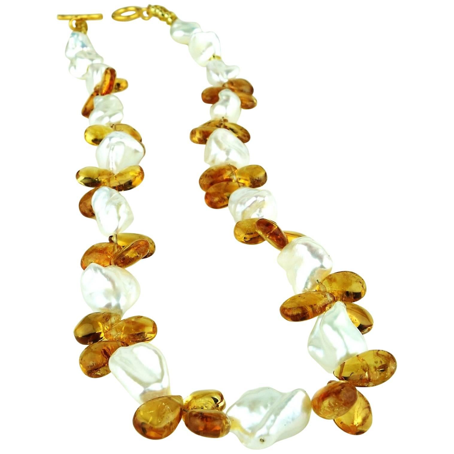 Custom made, lovely white, iridescent Keshi Pearl and Citrine necklace.  The Citrines are polished briolette clusters between the pearls.  The Keshi Pearls flash pink and yellow.  The vermeil toggle clasp secures this elegant, unique 17.5 inch one