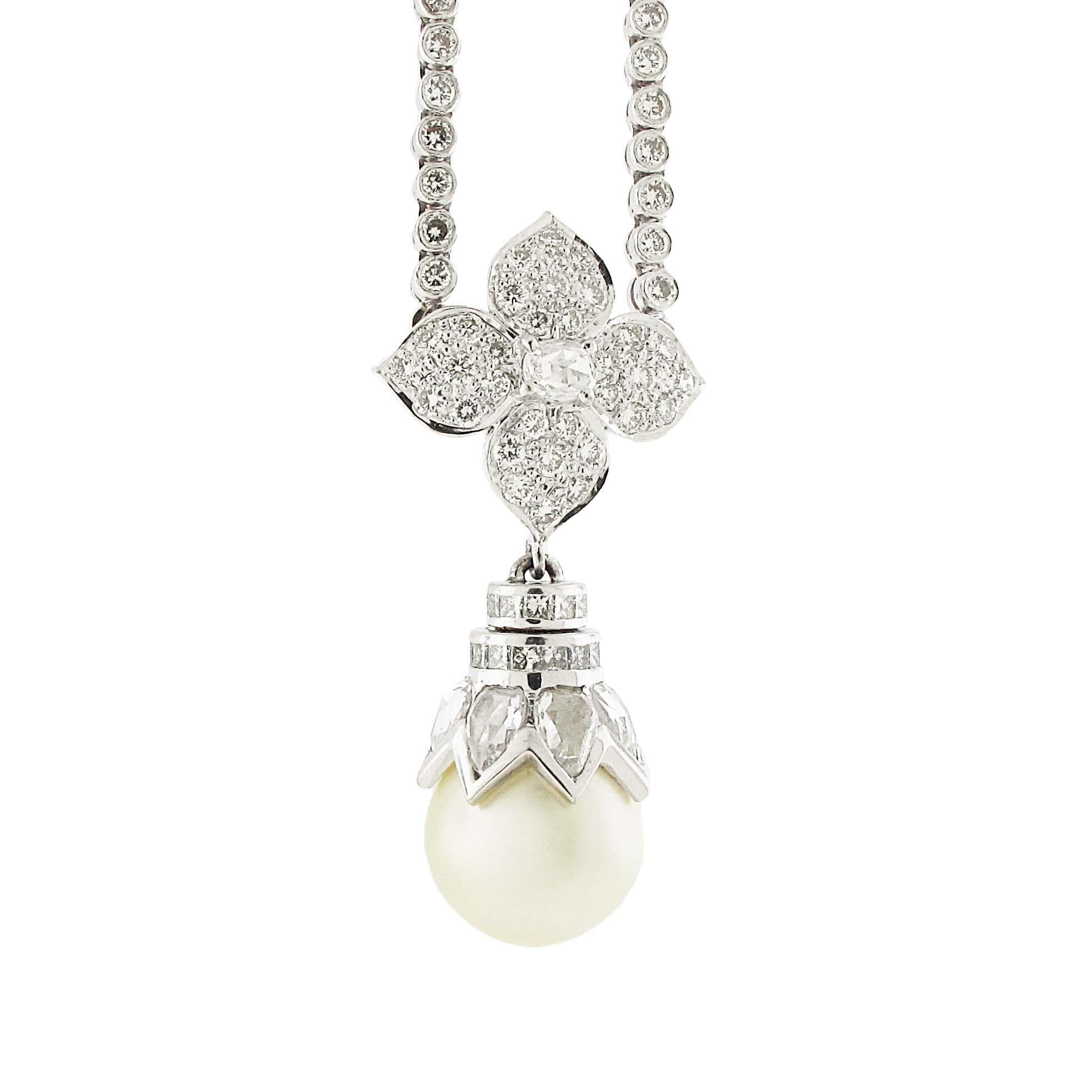 A truly elegant diamond and pearl pendant necklace. The center pearl is of extremely high quality and displays a high luster. The diamond topper is connected at the 10 and 2 position meaning it will sit perfectly on the neck. The chain also has