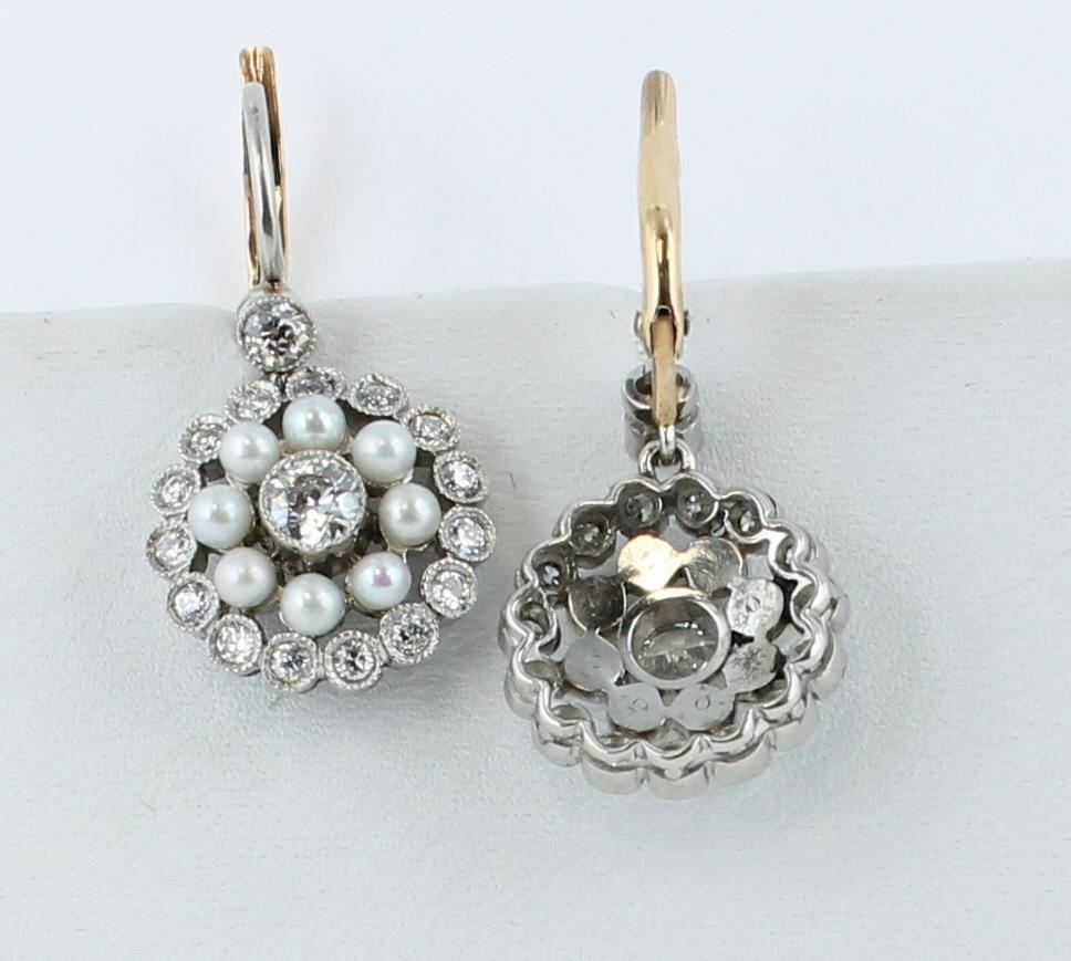 These 1920's platinum earrings have a magical quality.  There are 1.10 carats total weight of diamonds including one in the center of the earring, those trimming the outside of the earring and one at the top of the earring.  There is also a row of