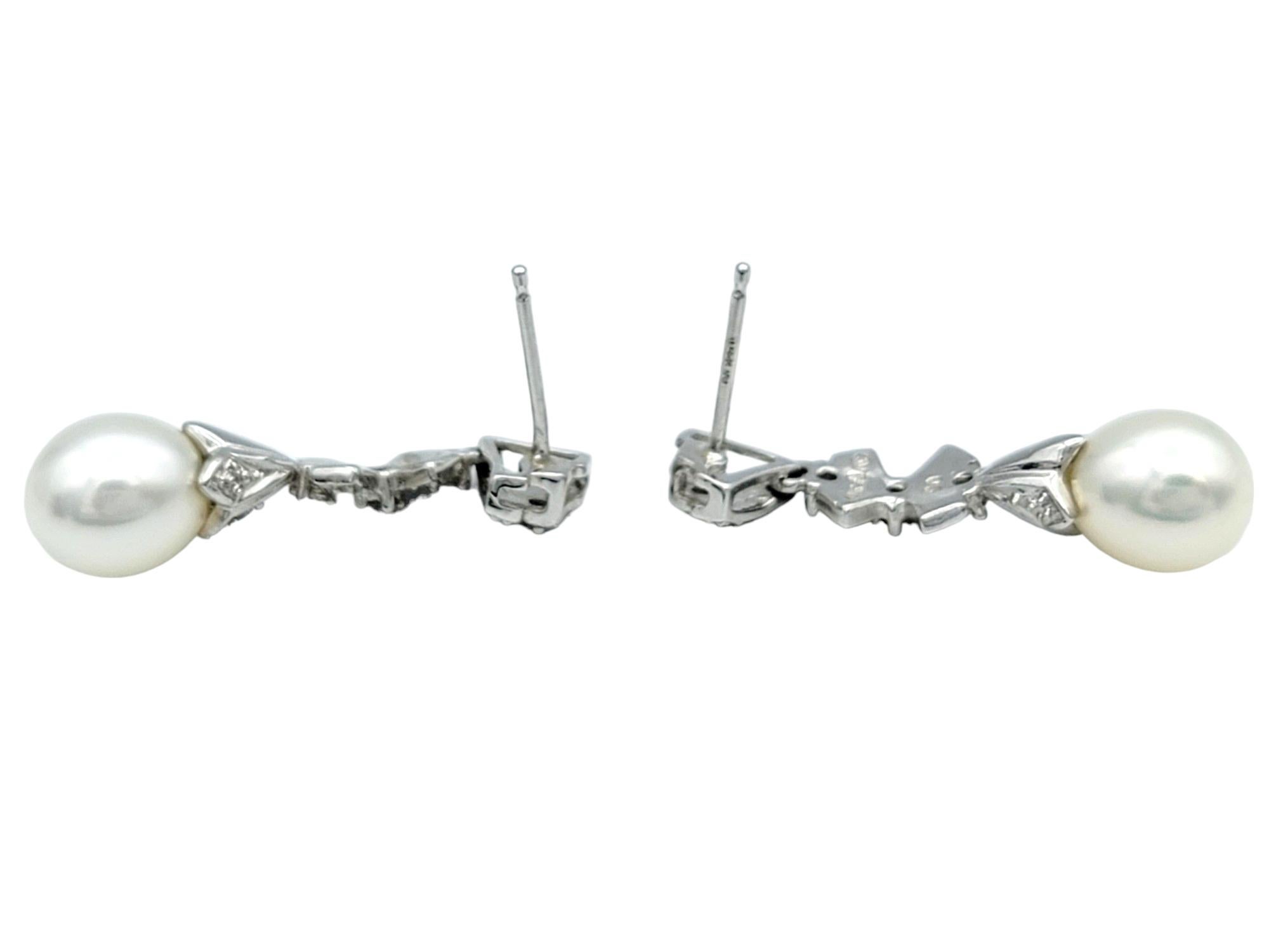 Pearl and Diamond Bow Design Dangle Earrings Set in 14 Karat White Gold In Good Condition For Sale In Scottsdale, AZ