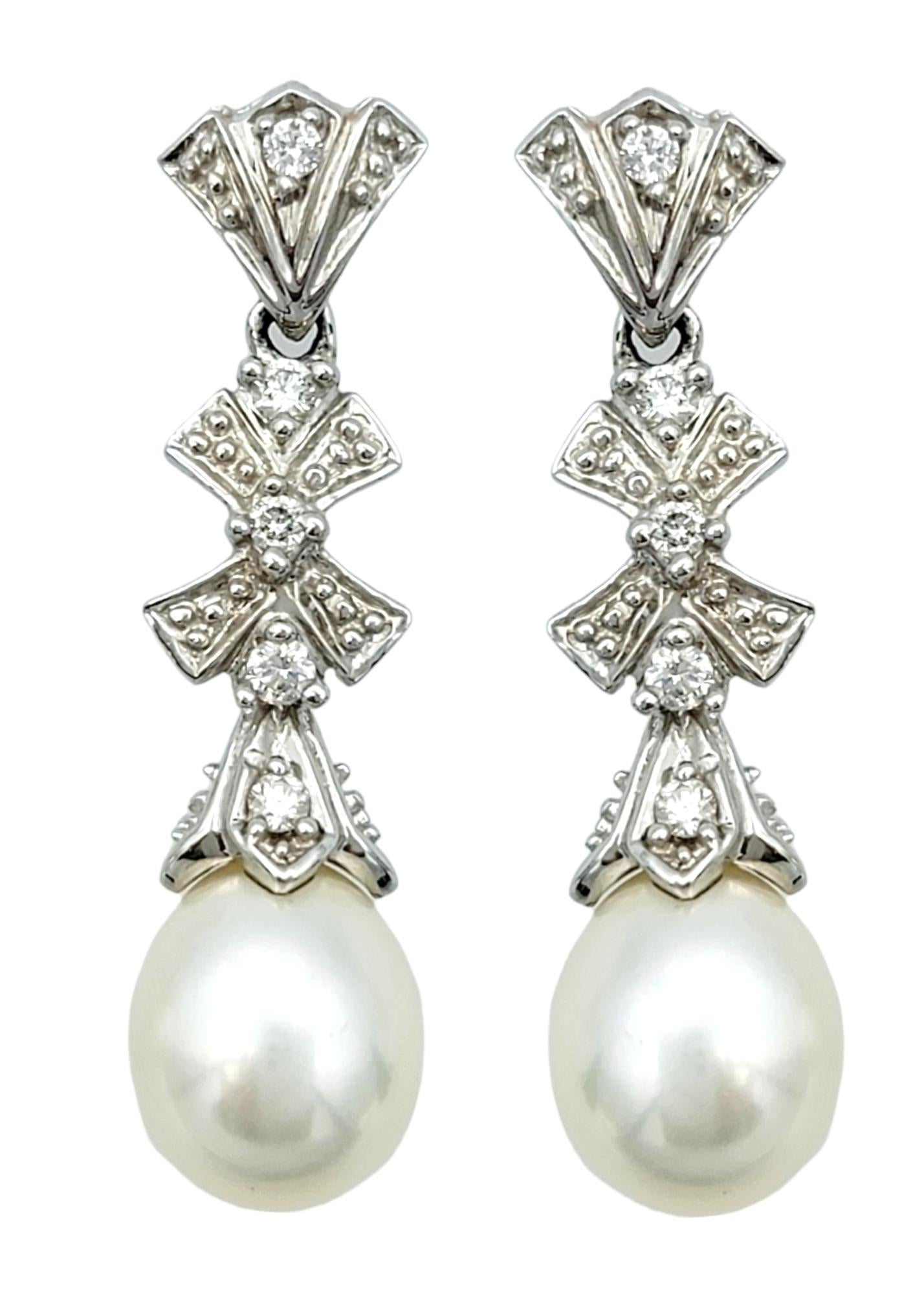 Pearl and Diamond Bow Design Dangle Earrings Set in 14 Karat White Gold For Sale