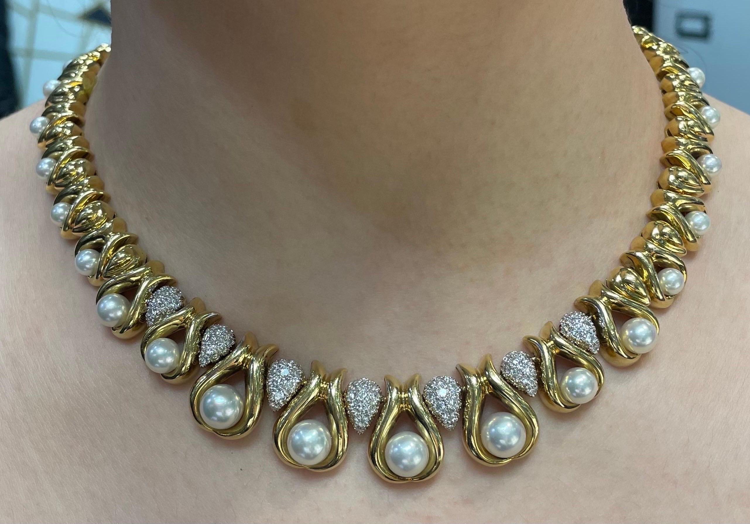 Pearl and Diamond Choker

A choker set with 26 cultured pearls and accented with round-cut diamonds. 

Approximate Diamond Weight: 5.00 Carats
Approximately Measures: 15