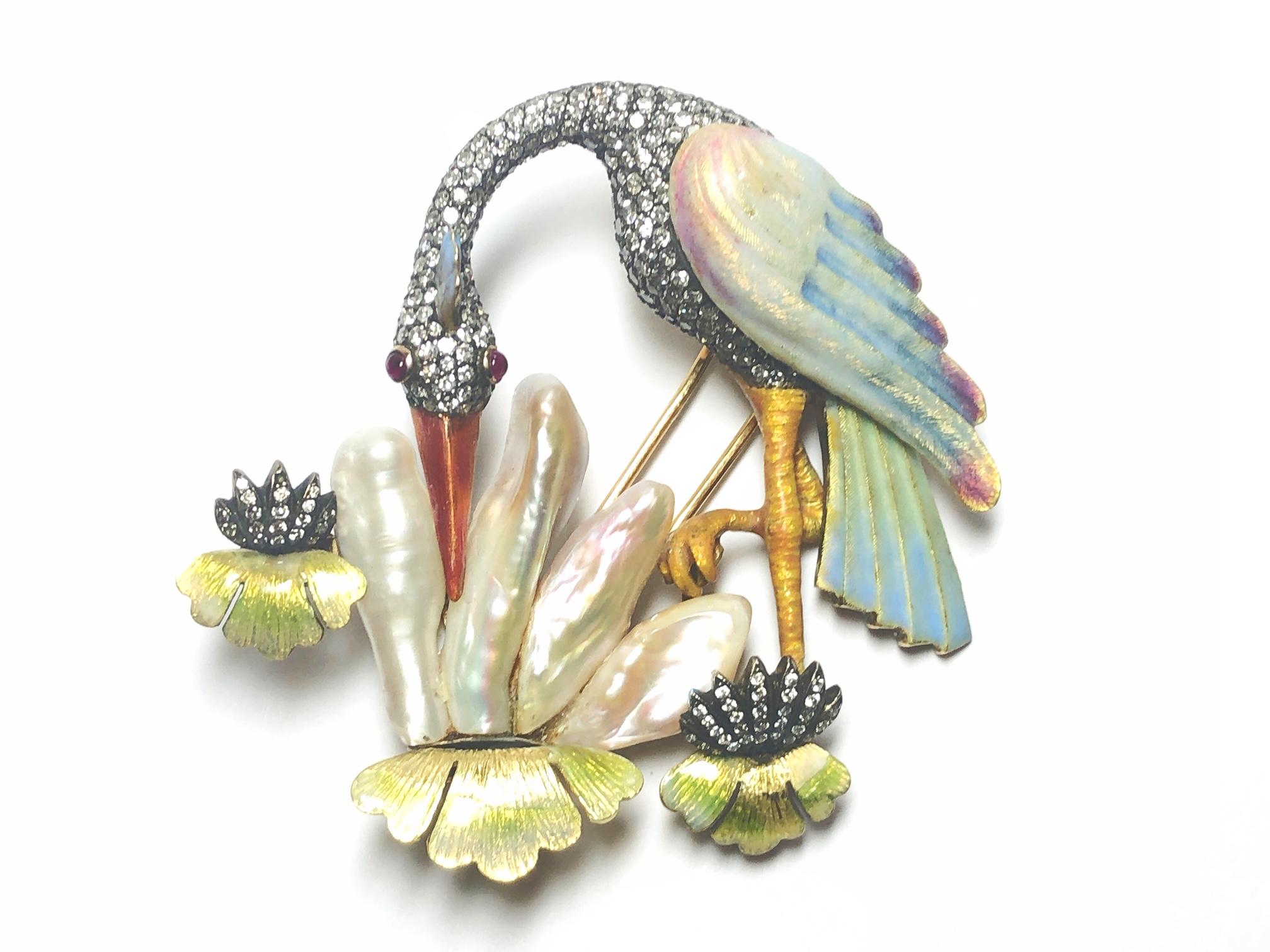 A Moira crane brooch, with basse taille enamel, pavé set with eight-cut and round brilliant-cut diamonds and Mississippi pearls, mounted in gold with silver settings. Signed Moira, numbered 5147 Moiras eponymous collection was inspired by clients