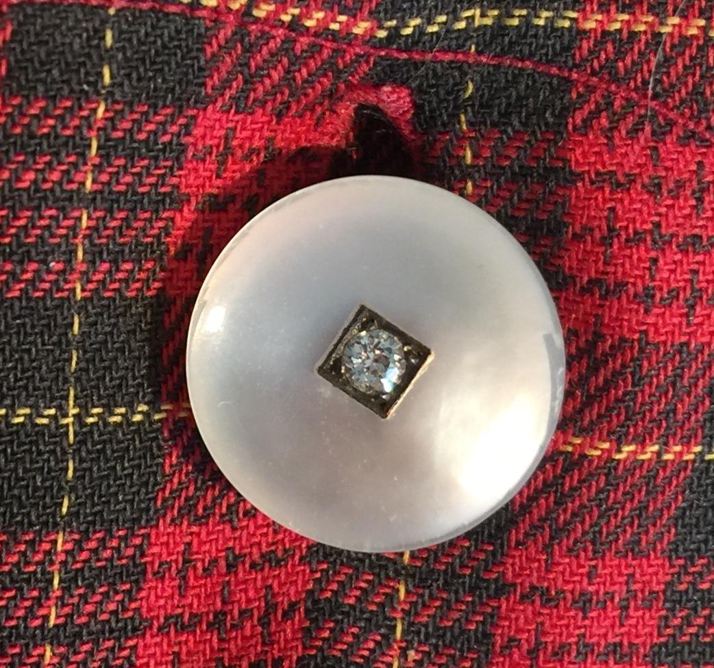 Sculpted and simple, yet stunning, is this pair of double sided cufflinks from the late Victorian period. The central area of the pearl has been carved to a lower plane than has the rim, a detail that gives the sphere added interest and enhances the