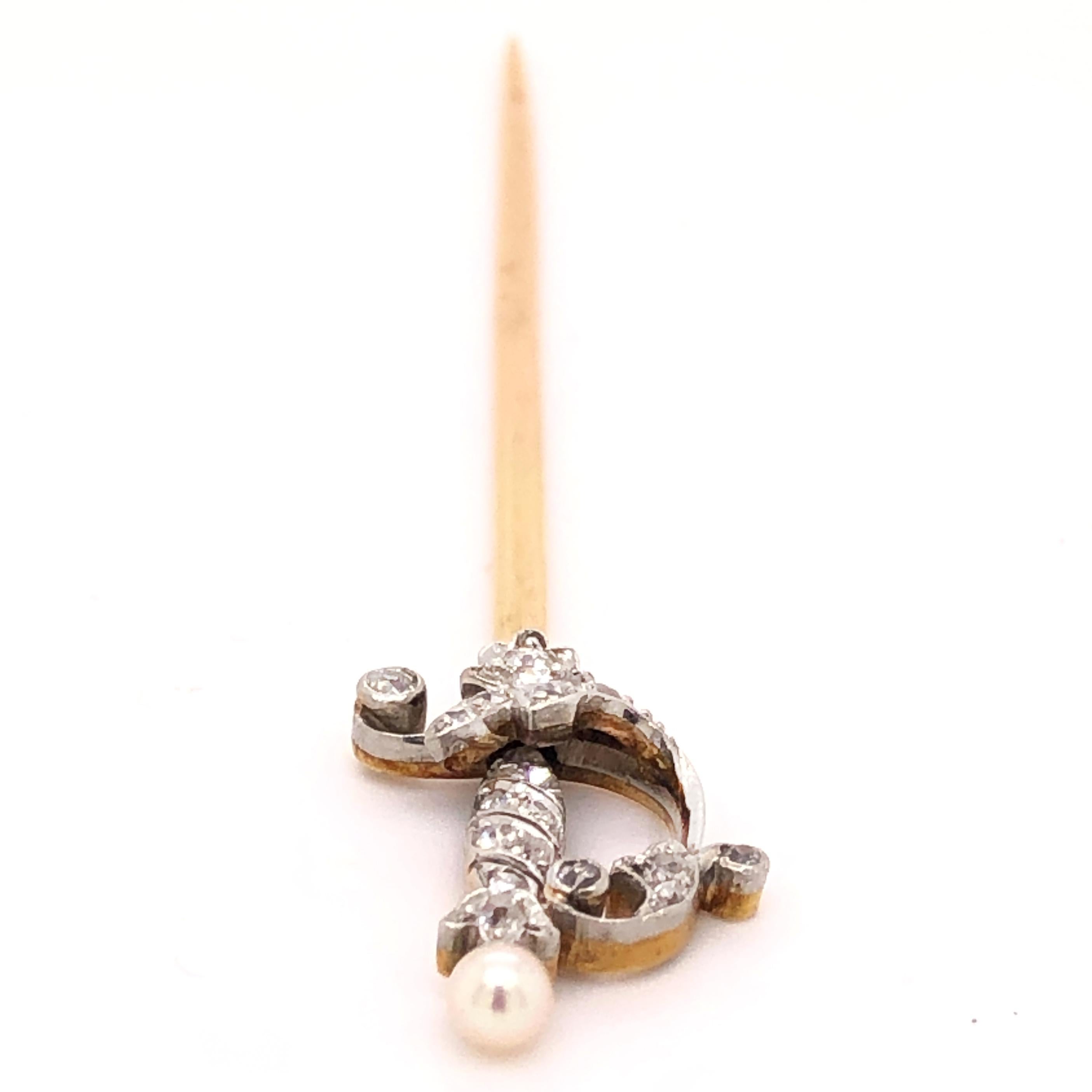 A finely made pearl and diamond dagger in yellow gold and silver. This piece can be used as a tie or hat pin and beautifully accentuates the outfit.