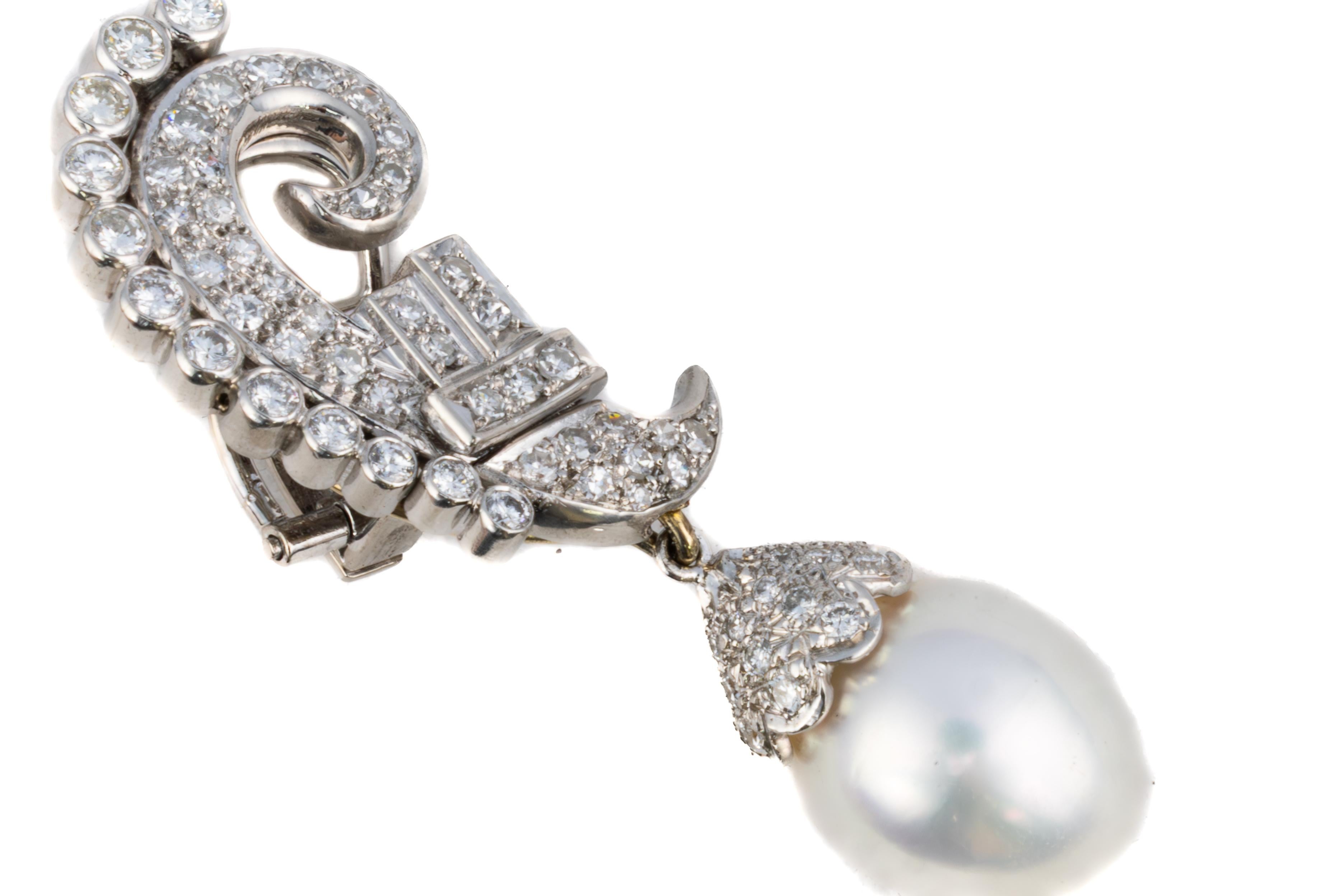 Diamond and Detachable Pearl Drop Earrings

Description:
A captivating pair of vintage earrings featuring scrolling forms pavé-set with brilliant-cut and baguette diamonds, culminating in magnificent Detachable pearl drops. The ornate scroll motif