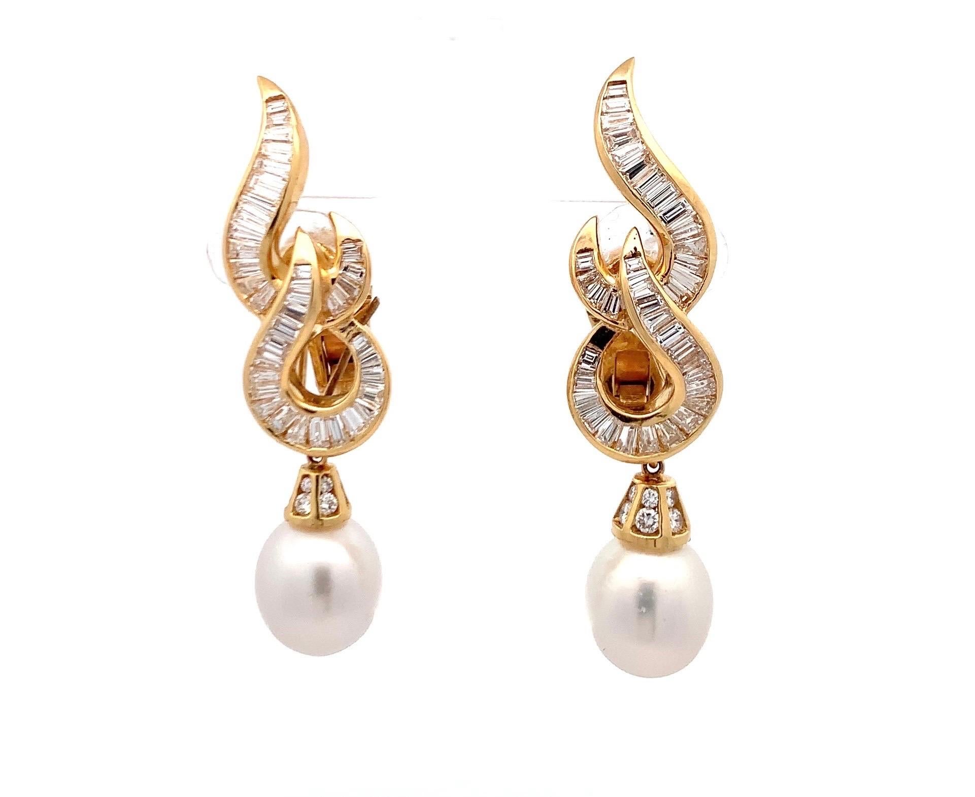 Pearl and Diamond Day and Night Earrings

A pair of yellow gold day and night earrings set with 72 baguette cut diamonds. The earrings come with 2 South Sea pearl attachments allowing the earrings to be worn in 2 ways.

Approximate Diamond Weight: