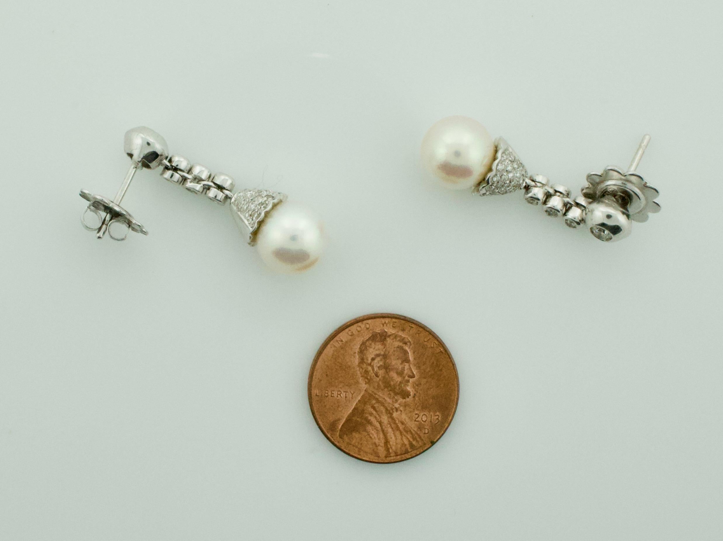 Round Cut Pearl and Diamond Drop Earrings in 18 Karat For Sale