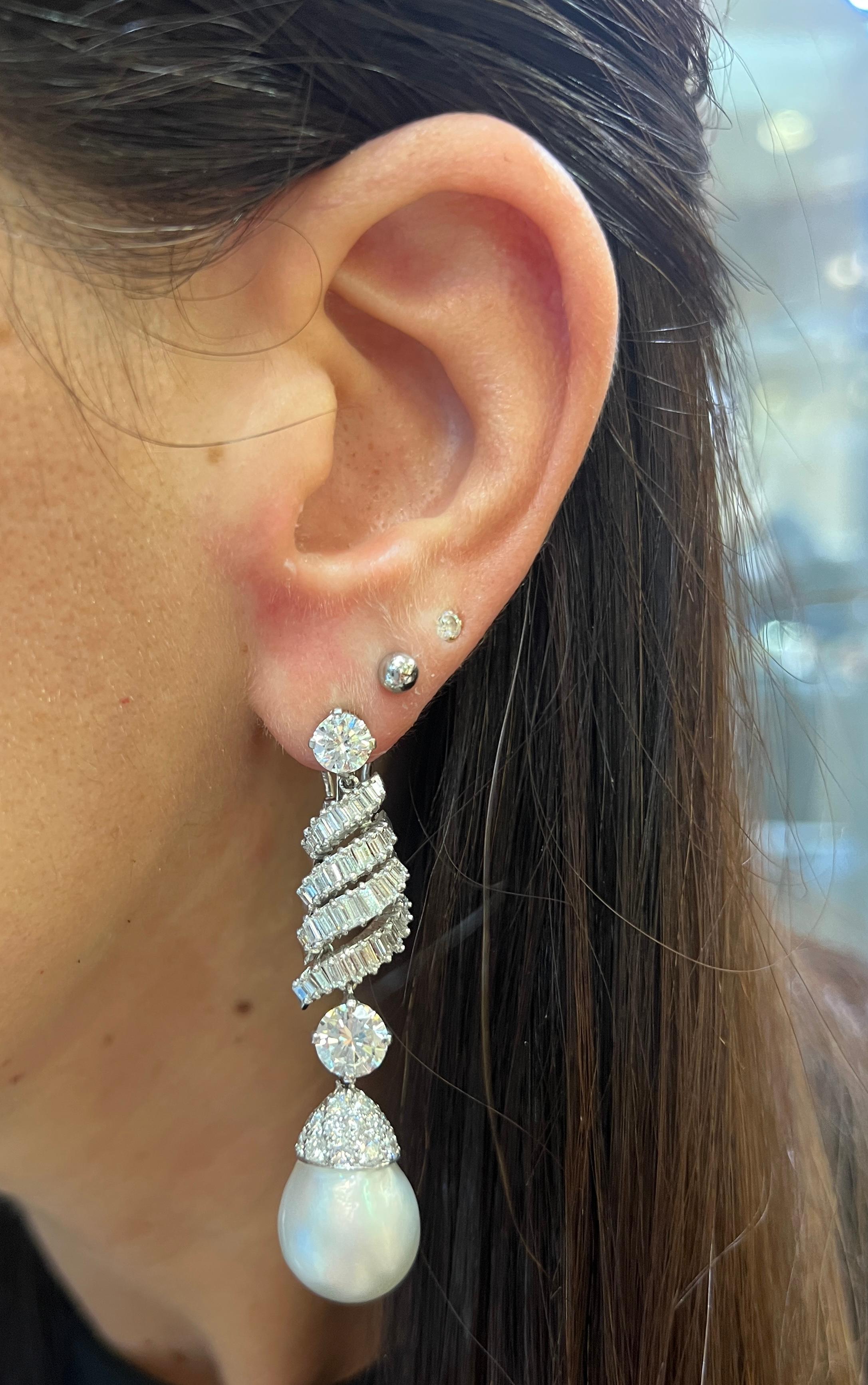 Pearl and Diamond Earrings

Earrings featuring two South Sea pearls adorned with round cut and baguette diamonds. 

Approximate Length: 2.25