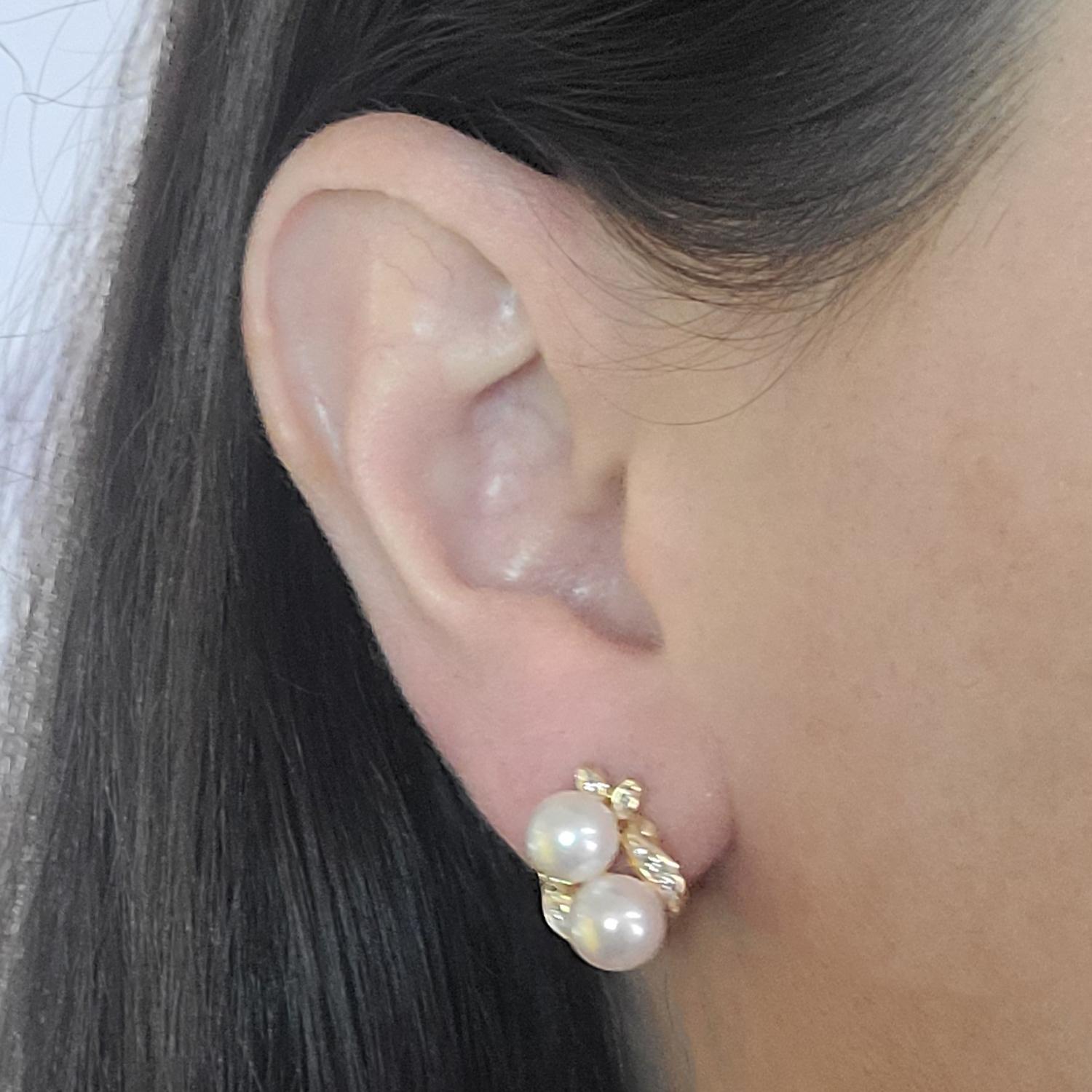 18 Karat Yellow Gold Earrings Featuring 4 Cultured Pearls Measuring 7mm and 20 Channel Set Round Brilliant Cut Diamonds of VS Clarity and G Color Totaling 0.25 Carats. Pierced Post with Omega Clip Back. Post Removed Upon Request. Finished Weight is
