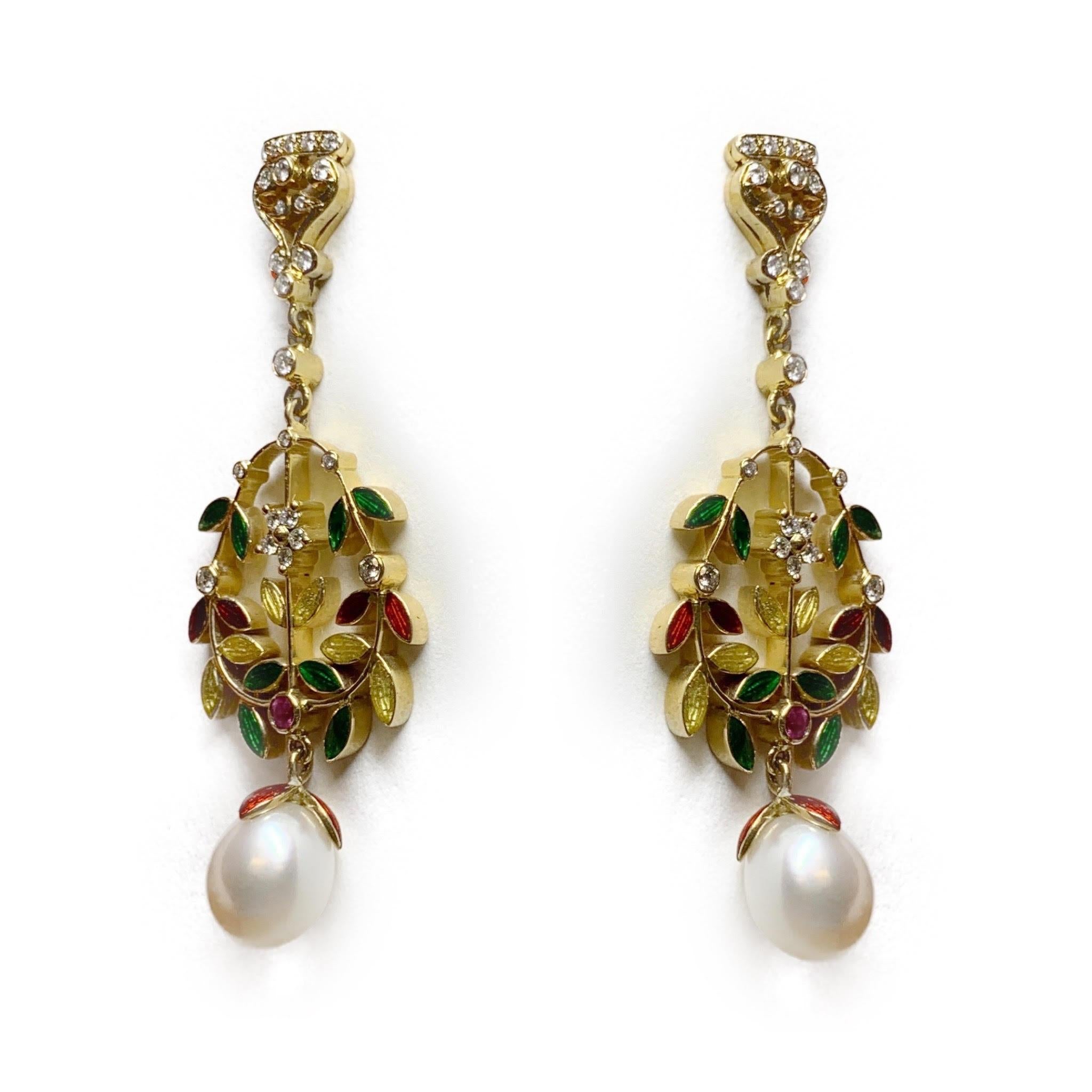 These flowery dangle earrings have pops of color, gleaming diamonds, and a beautiful pearl drop. Set in vibrant 18 Karat Yellow Gold. These earrings are the perfect combination of fancy and fun. 

Pearl and Diamond Earrings with Red, Yellow, and