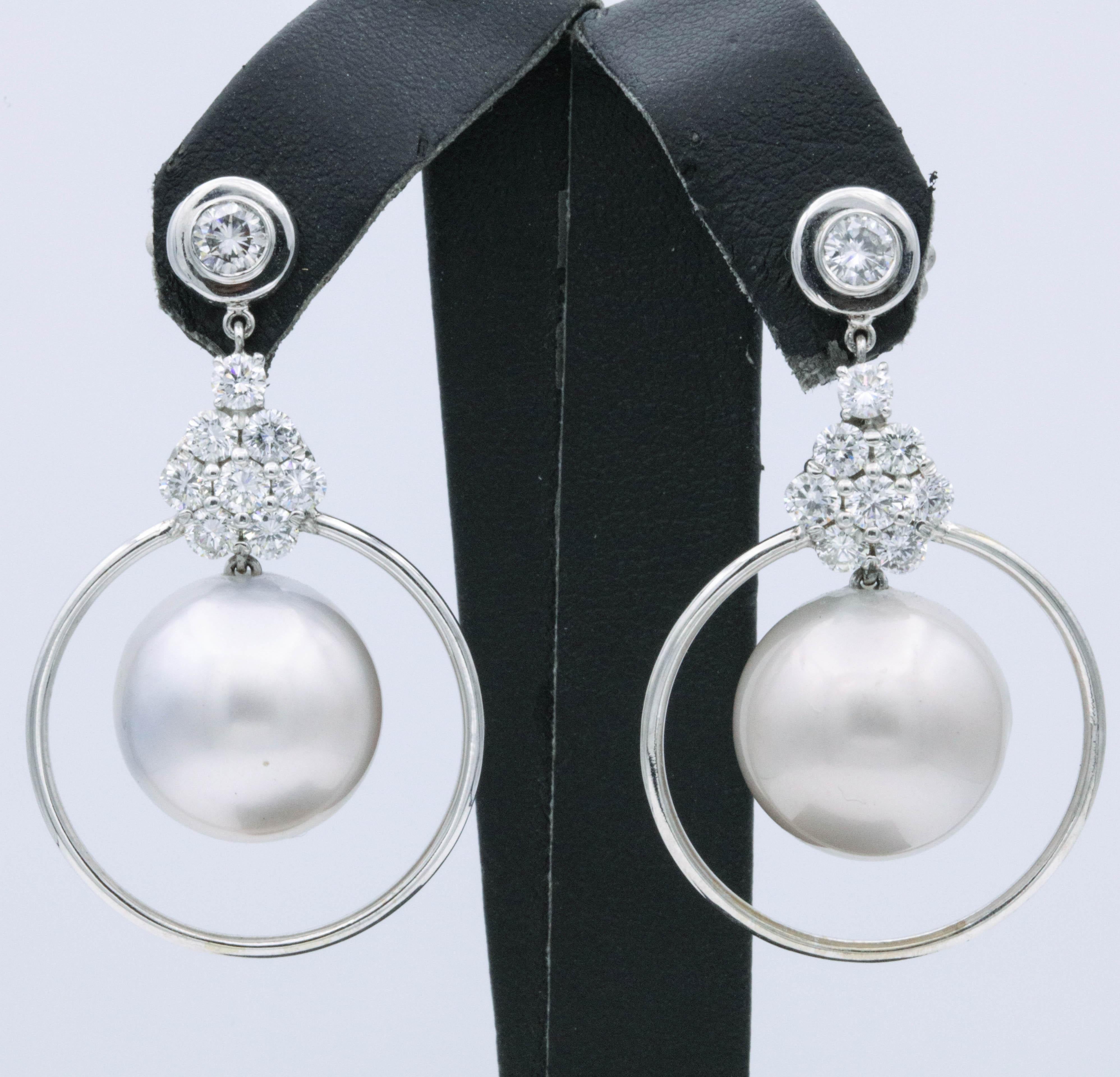 Pearl and diamond floral drop/hoop earring featuring 16 round brilliants weighing 2.21 carats, crafted in 14k white gold. 
Color: G-H
Clarity: SI
