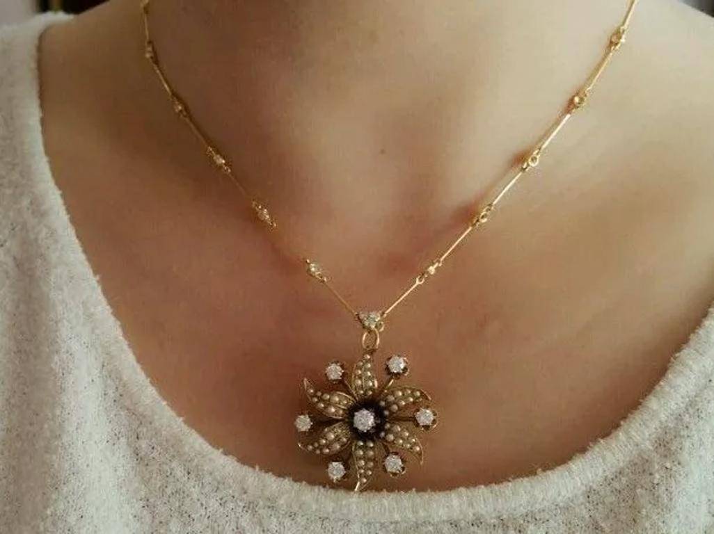 Vintage Pearl and Diamond Flower Pin/Pendant Necklace in 14k and 18k Yellow Gold

Beautiful Antique Flower Pin/Pendant features a Flower design with an Old European cut Diamond in the center with an estimated weight of .35 carat, with Seed Pearls on