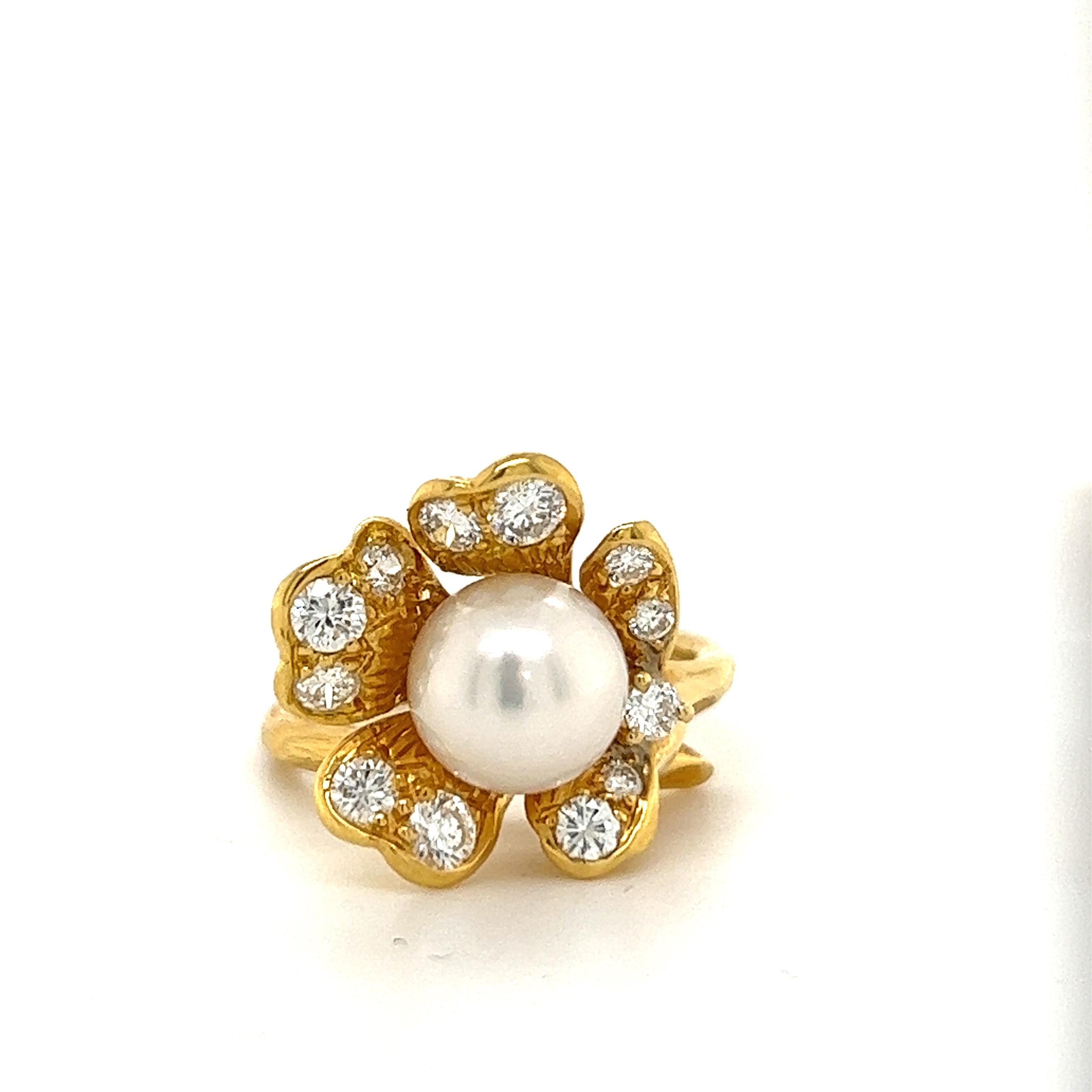 IThis unique ring is beautifully crafted. It has a akoya pearl in the center of the flower with .75tcw, G color, VS2 clarity, of white diamonds on the pedals. 