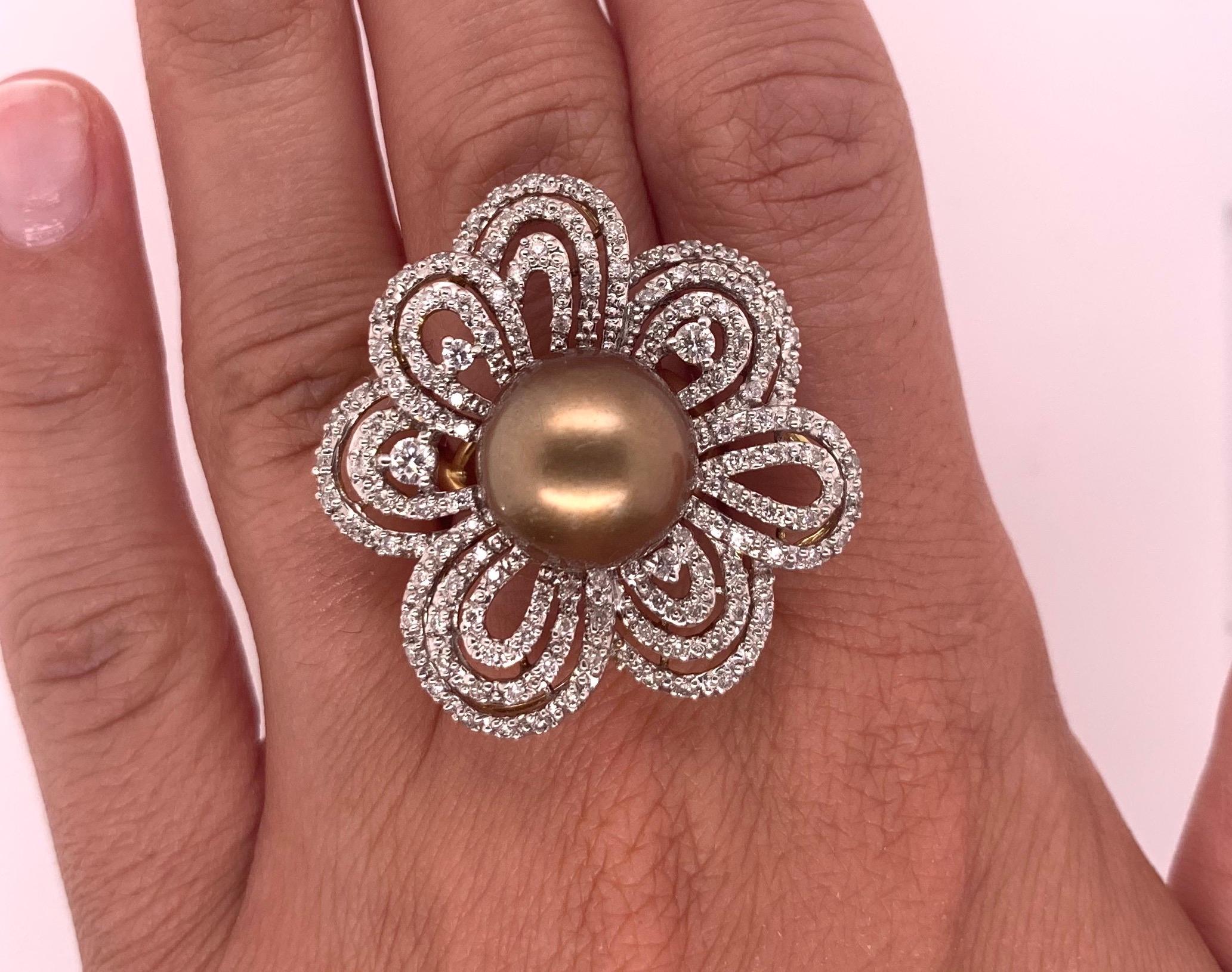 Material: 18K Two Tone Gold
Gemstone Details: 1 Round Pearl - 12.7mm
Diamond Details: Brilliant Round White Diamonds at 0.98 Carats. VS-SI Clarity / H-I Color. 

Ring Size: 6.75. Alberto offers complimentary sizing on all rings.

Fine one-of-a kind