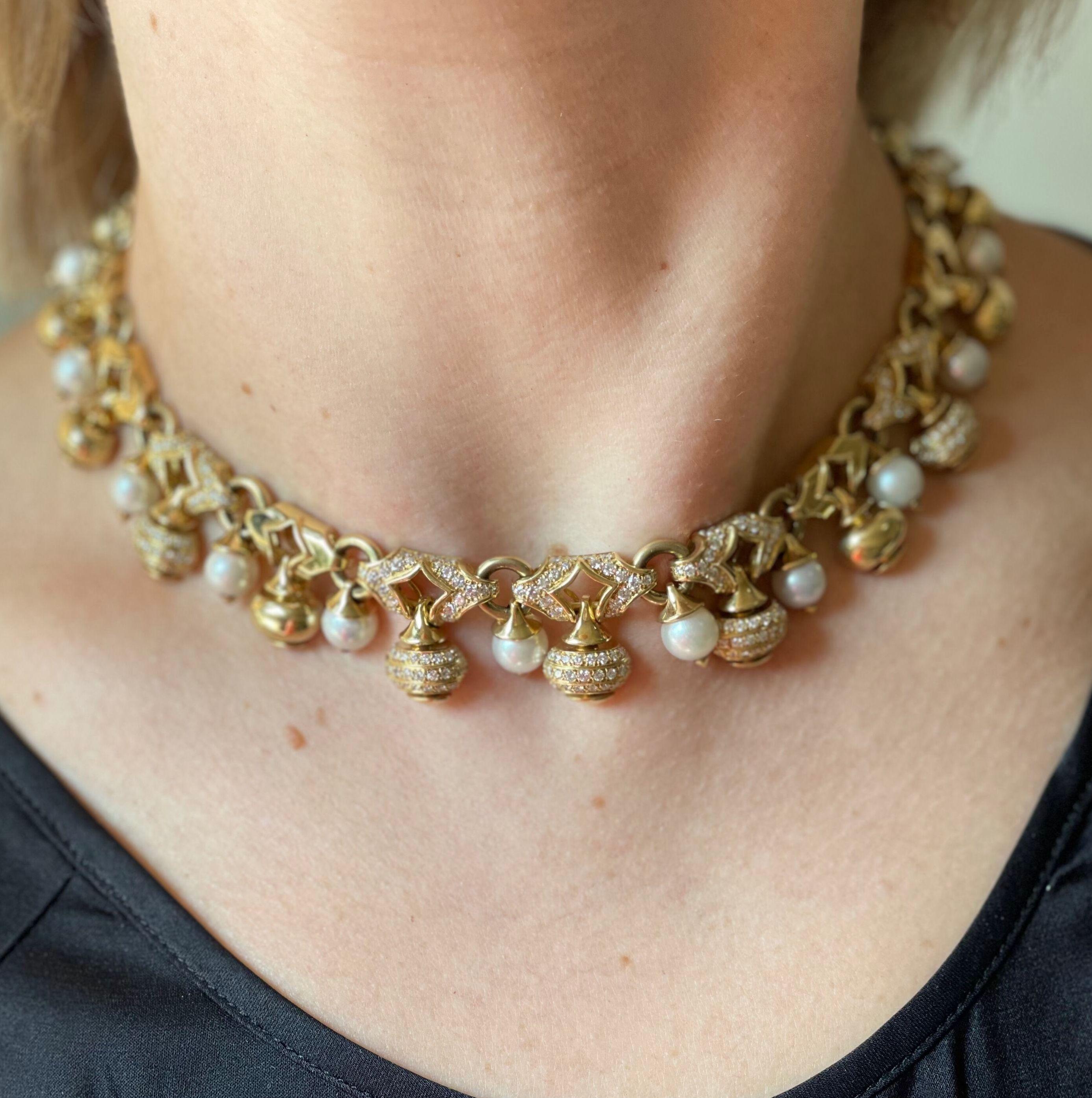 1980s 18k gold cocktail necklace, adorned with 8mm pearls and approx. 2.80ctw H/VS-Si diamonds. Necklace is 15.5