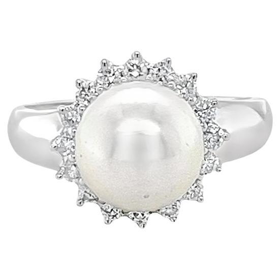 Pearl and diamond halo ring in white gold