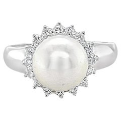 Pearl and diamond halo ring in white gold
