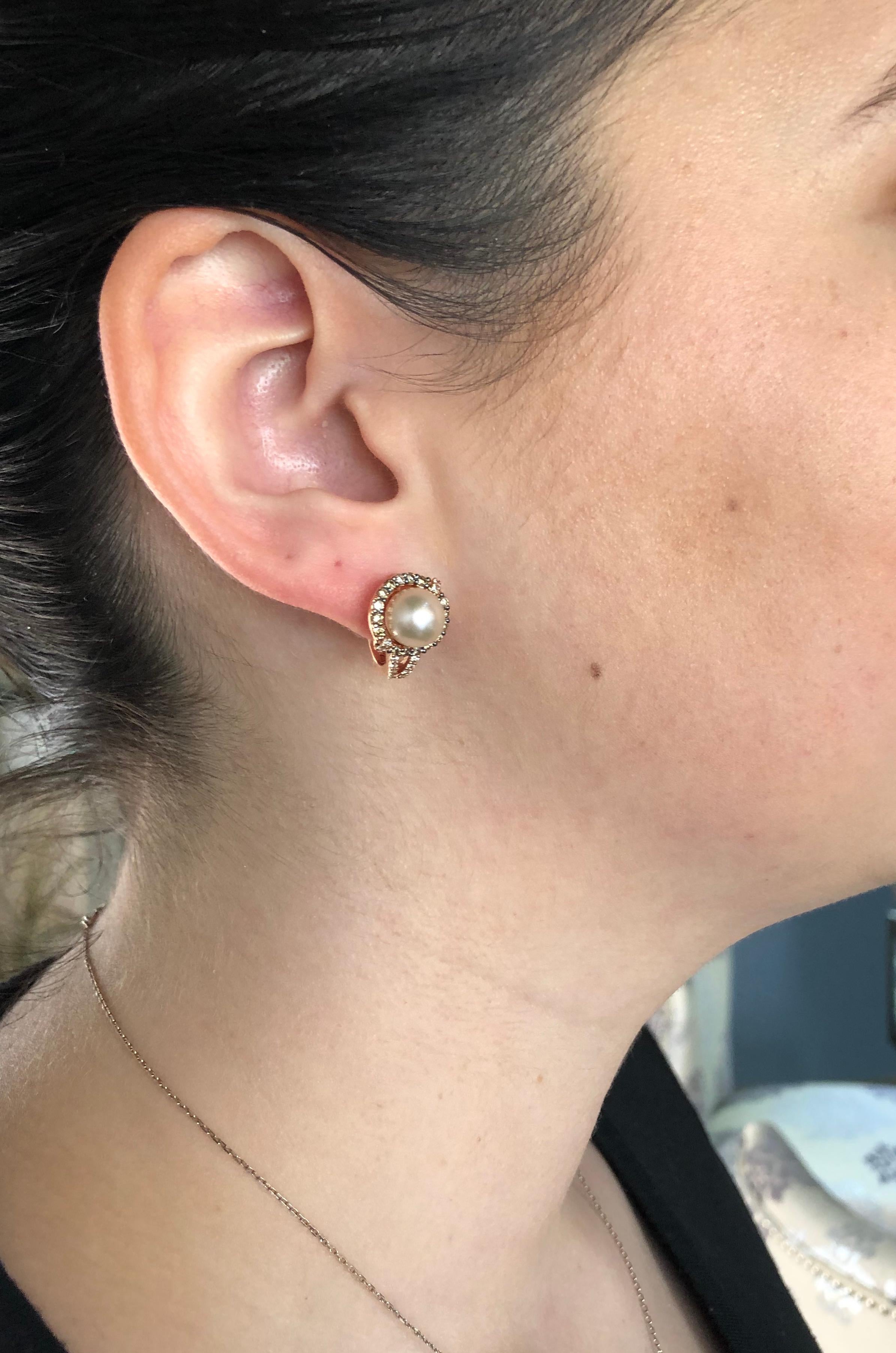 Le Vian pink pear and chocolate diamond earrings set in 14K rose gold.

Gemstone: Pearl & Diamond
Gemstone Carat Weight: Approximately 8.3mm Round Light Pink Pearl
Diamond Carat Weight: Approximately .72CTW
Diamond Cut: Round Brilliant
Color:
