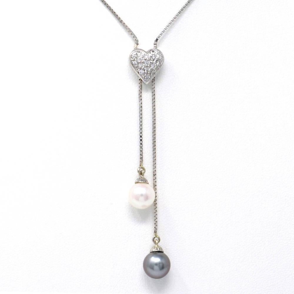 Our one of a kind saltwater pearl and diamond necklace featuring identical white and gray pearls and diamonds totaling 0.25 carats. This piece is perfect for gift giving or simply to treat yourself. 