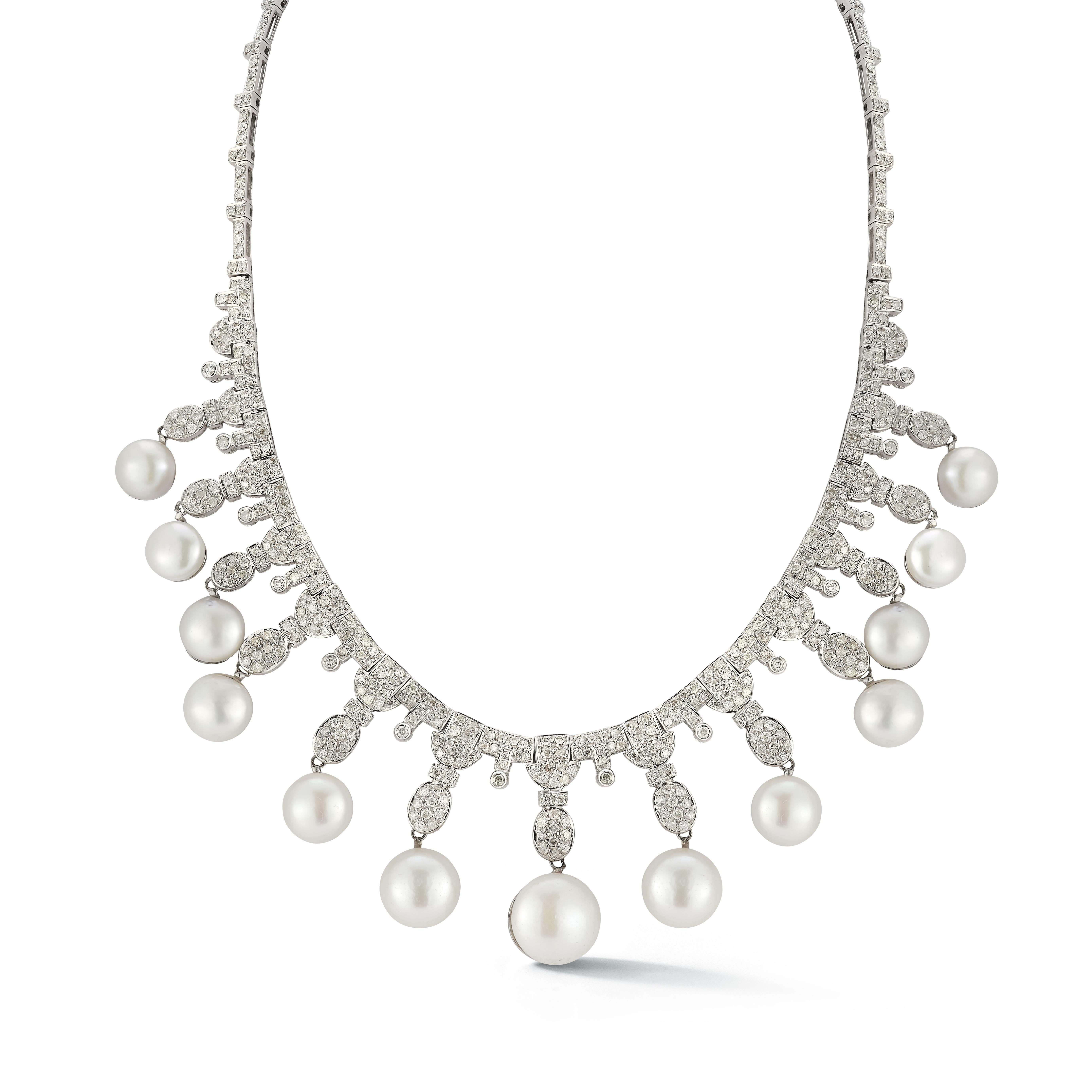 Pearl and Diamond Necklace

An 18 karat white gold necklace set with 13 pearls and round diamonds weighing approximately 11 carats

Length: 16
