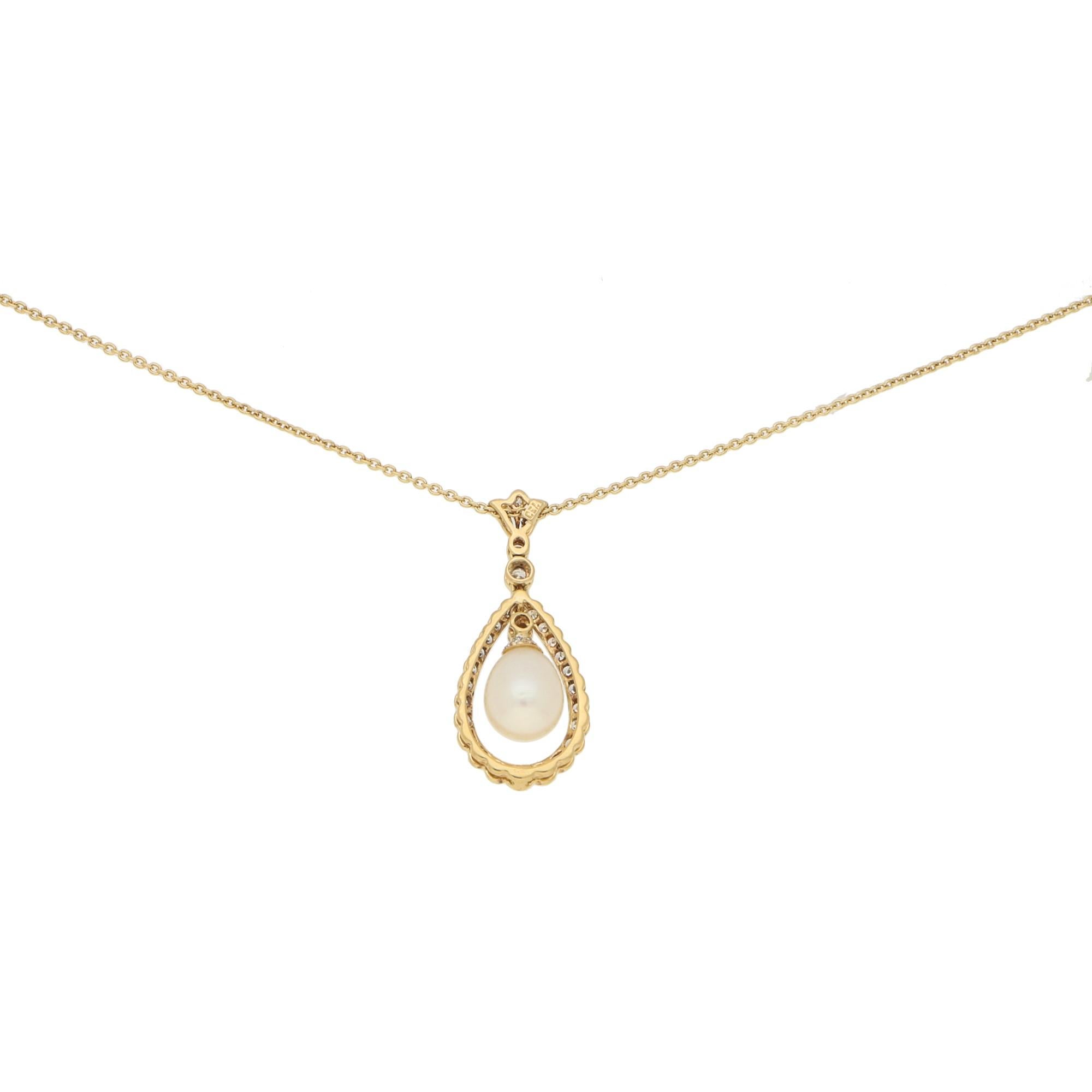  A beautiful pear shaped cultured pearl measuring approximately 7 x 9mm suspended from a diamond set drop with a pear shaped surround below an articulated lotus flower with two further droplets of diamond. 
There are 38 diamonds of varying sizes