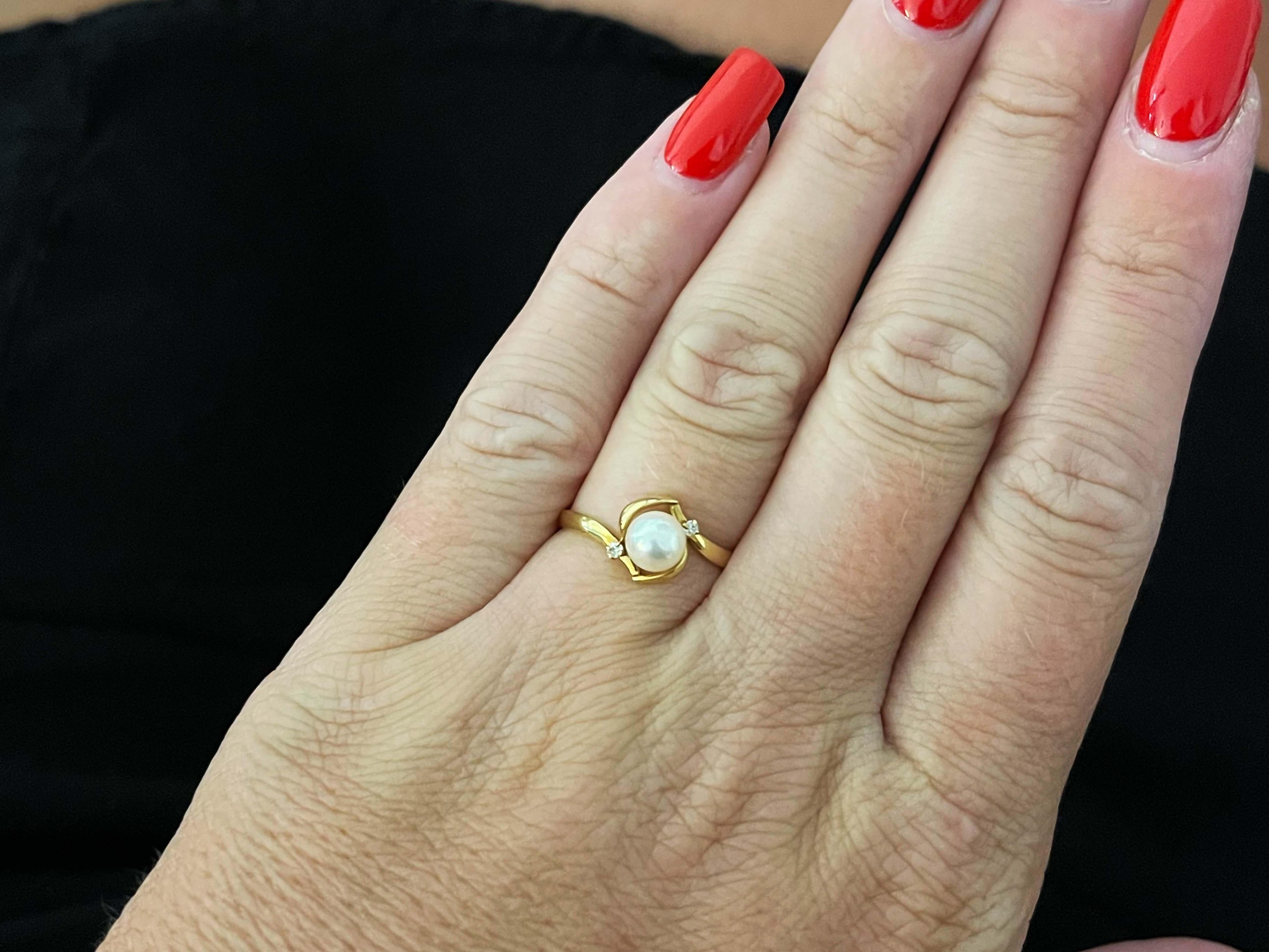 Item Specifications:

Metal: 18K Yellow Gold 

Total Weight: 1.3 Grams

Ring Size: 6.5 (resizable)

Gemstone Specifications:

Center Gemstone: Akoya Pearl

Pearl Diameter: 5.6 mm

Diamond Count: 2 round brilliant cut
​
​Diamond Color: H
​
​Diamond