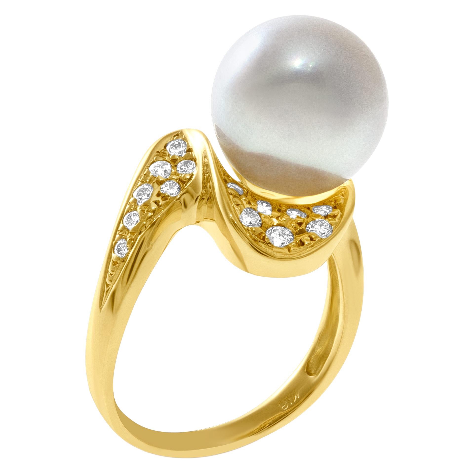 Pearl and diamond ring in 18k yellow gold with center silver pearl 11.3mm. Size 6.25.

This Pearl/diamond ring is currently size 6.25 and some items can be sized up or down, please ask! It weighs 5 pennyweights and is 18k.