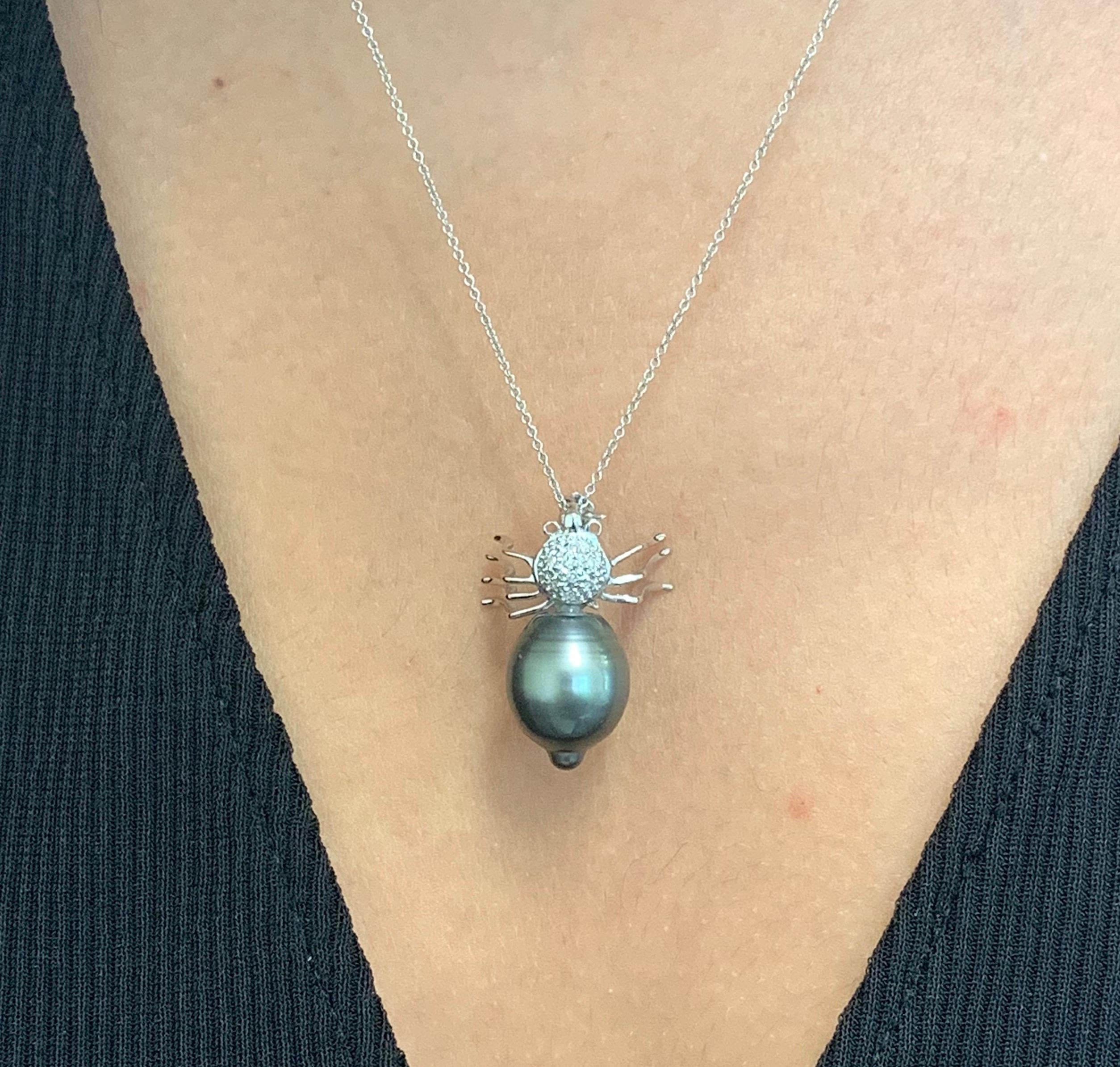 Material: 14K White Gold
Center Stone Details: 1 Round Tahitian South Sea Pearl 
Diamonds: 1 Round Brilliant Diamonds at 0.05 Carats. SI Clarity/ H-I Color

Fine one-of-a-kind craftsmanship meets incredible quality in this breathtaking piece of