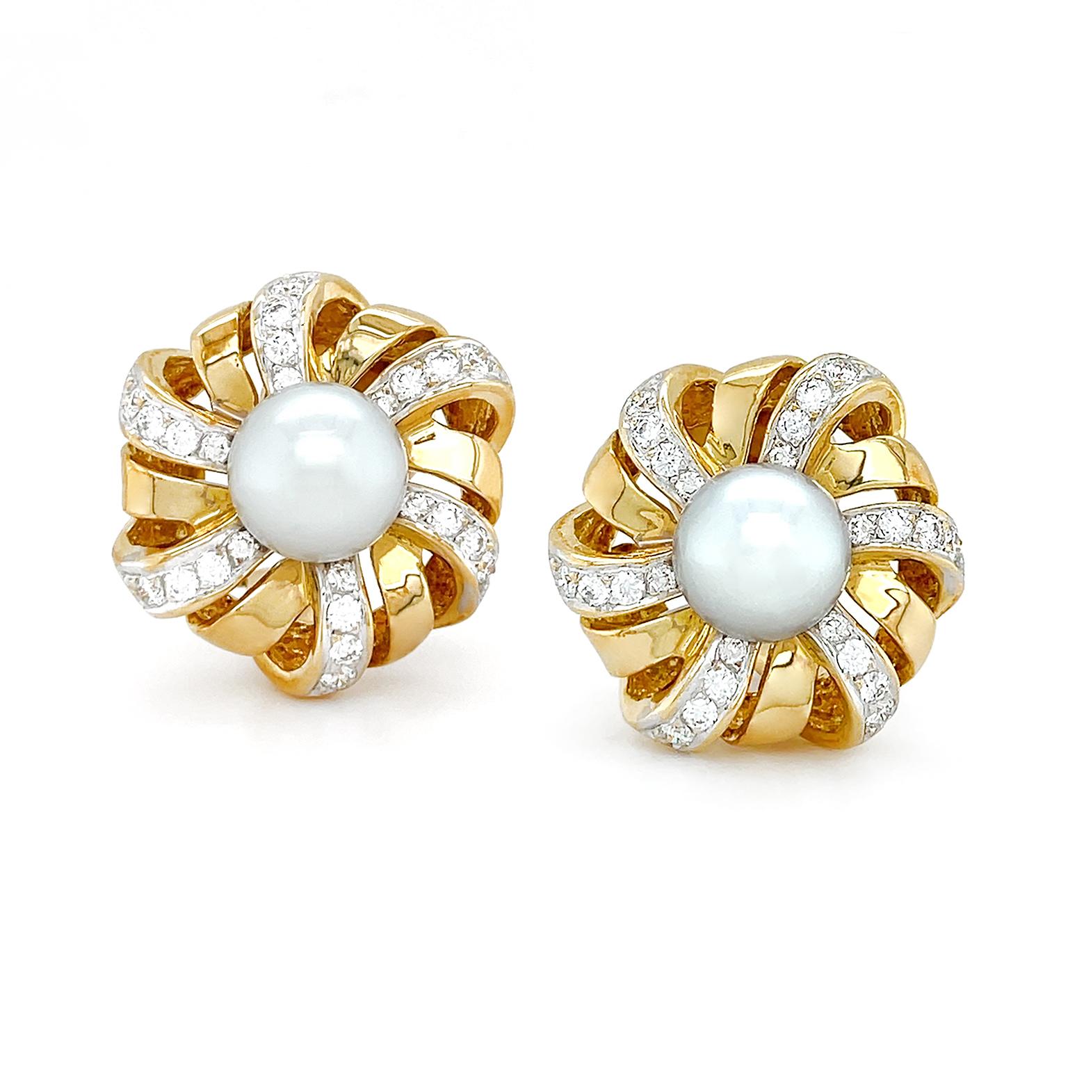 White pearls are the heart of this motif. Rotating around the pearl, 18k yellow gold ribbons create an openwork hexagon. Every other ribbon is pave set with diamonds for a glistening accent, totaling 1.33 carats. The clip-back earrings measure 0.92
